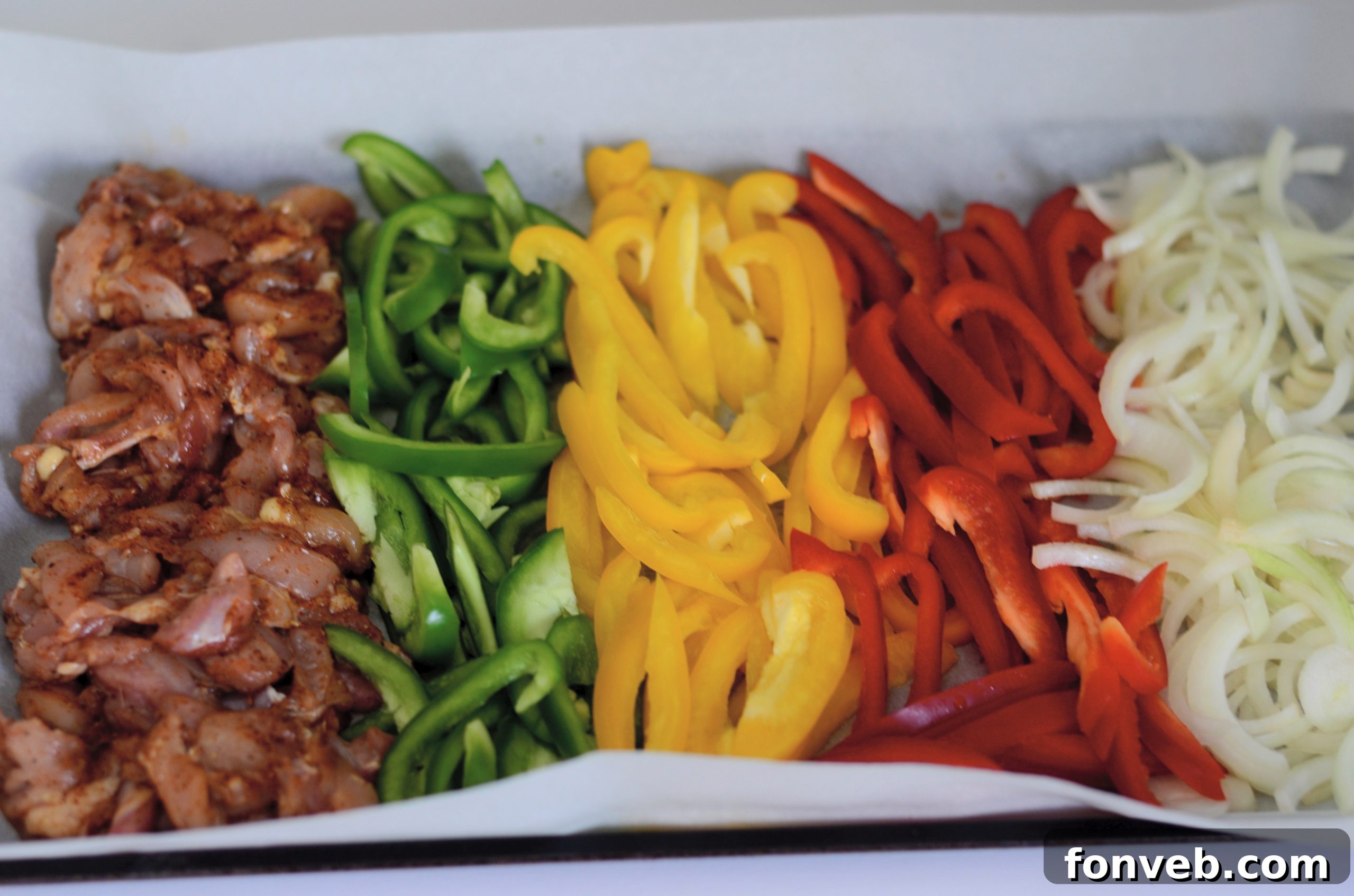 Close-up of Sheet Pan Chicken Fajitas, showcasing the perfectly cooked chicken and colorful vegetables.