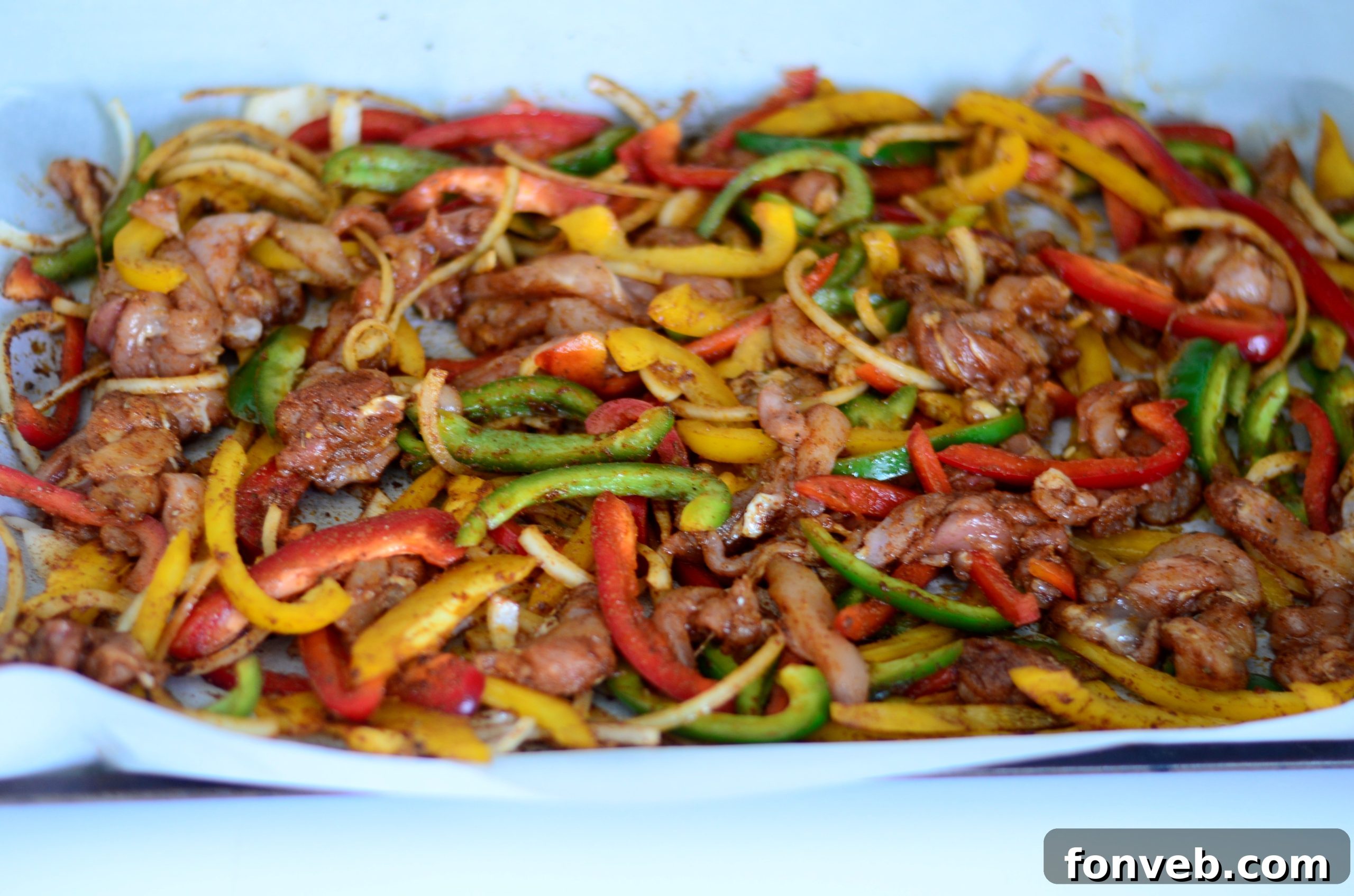 Another view of Sheet Pan Chicken Fajitas, highlighting the vibrant colors and appealing presentation.