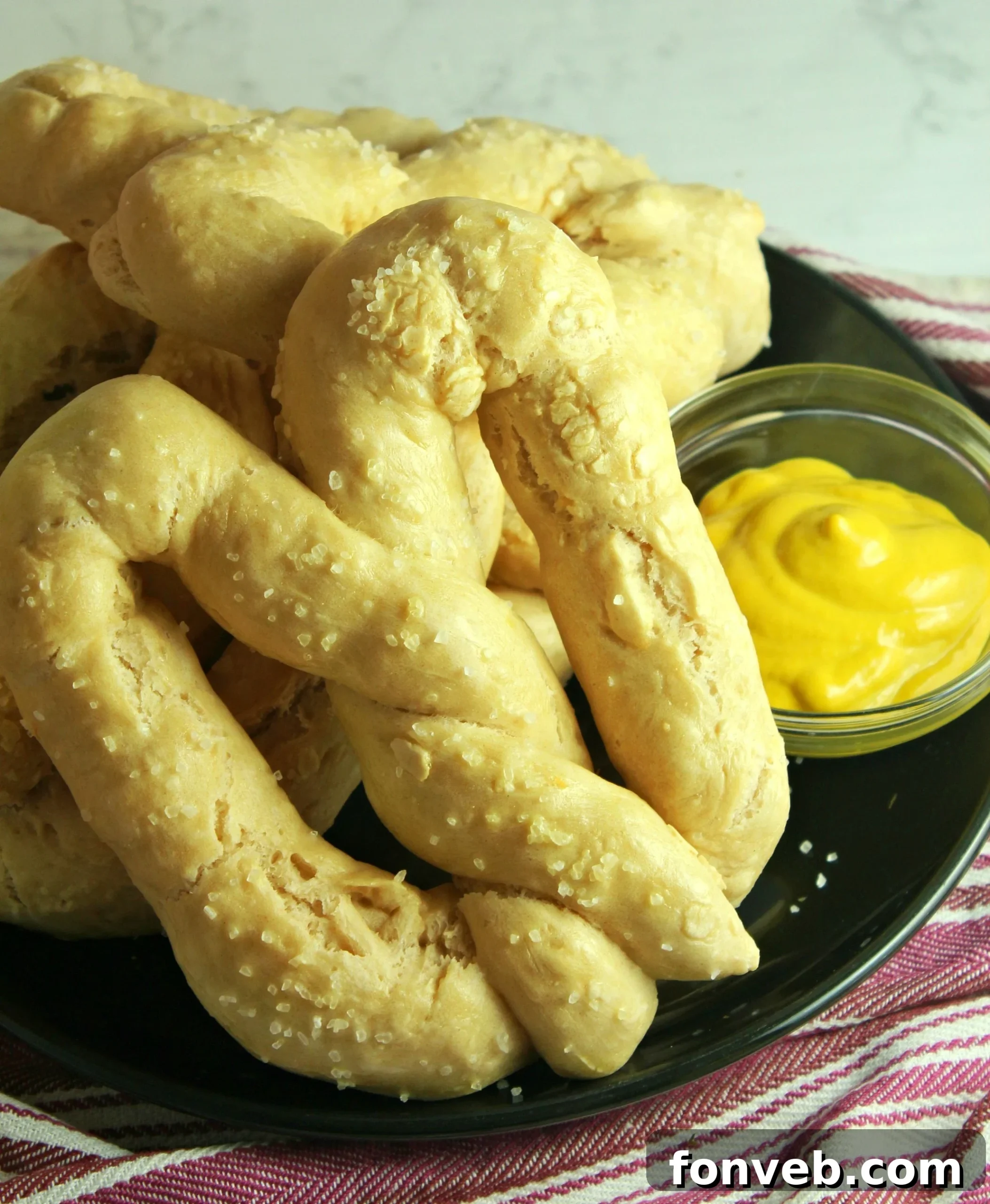 Warm Buttery Homemade Soft Pretzels 2 Freshly baked homemade soft pretzels on a baking sheet