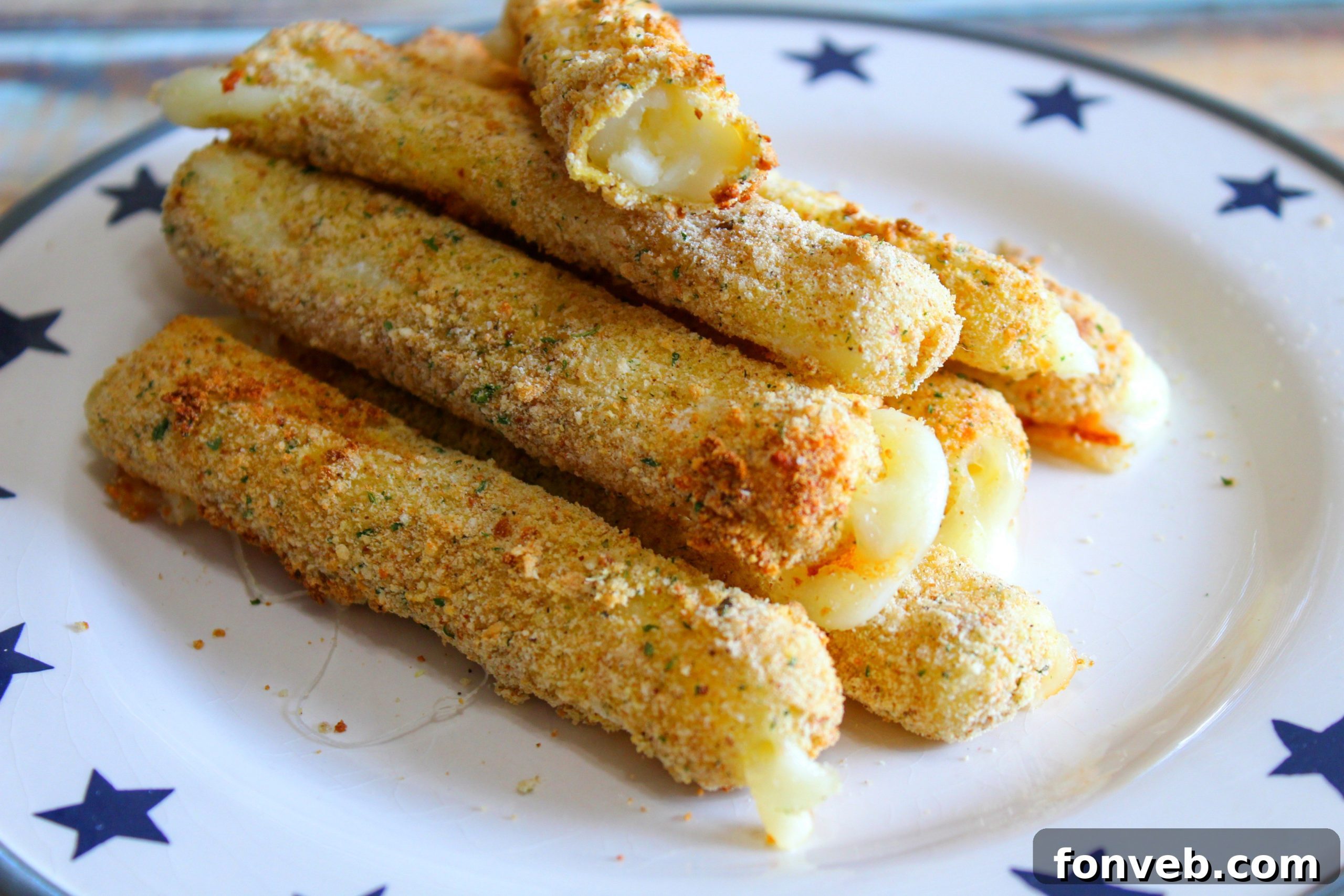 A close-up of a single Air Fryer Mozzarella Stick, showcasing its crispy coating and the slight golden hue.