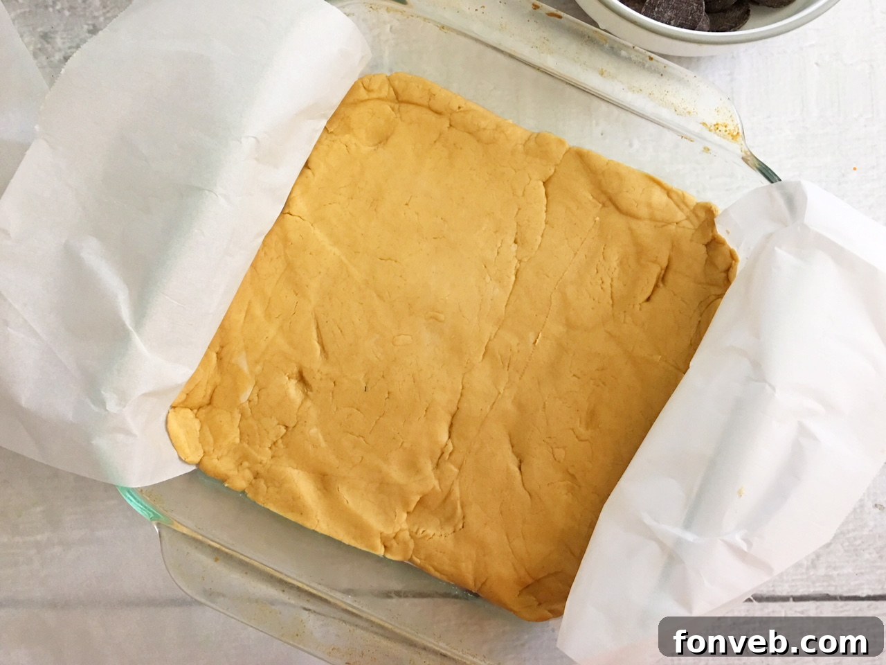 Close-up of heart-shaped peanut butter filling ready for chocolate dipping