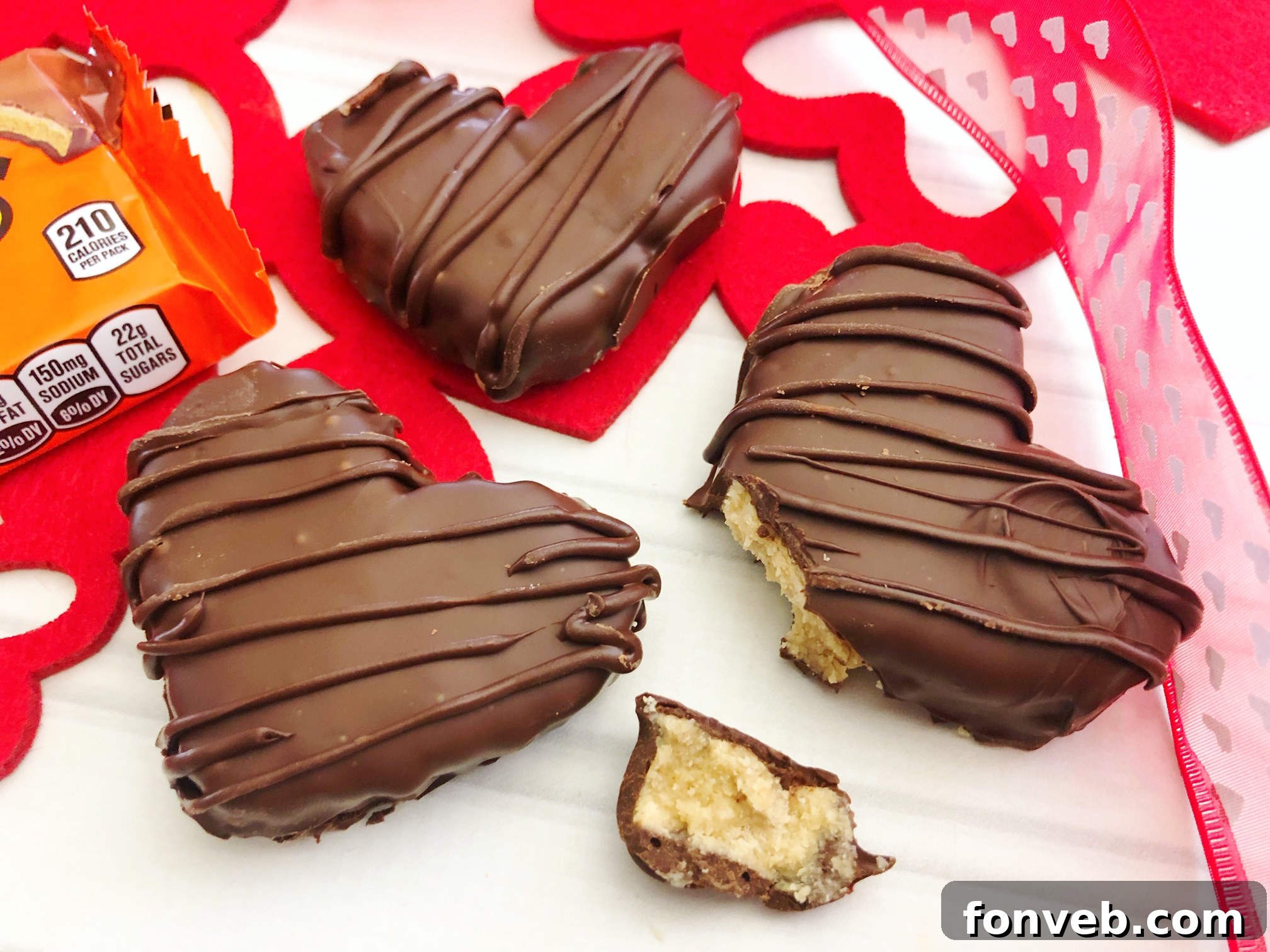 A close-up of a finished Reese's Peanut Butter Heart with a decorative chocolate drizzle
