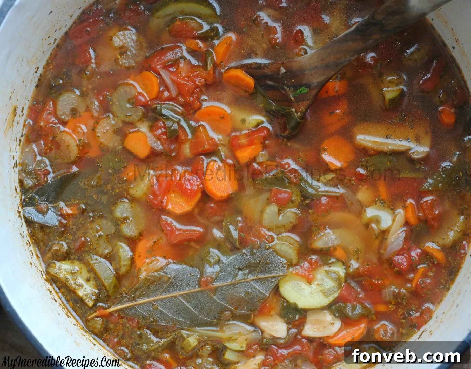close up shot of the Weight loss soup in a red dutch oven pot on a dark wood table 