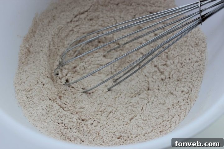 Apple bread batter being prepared in a mixing bowl