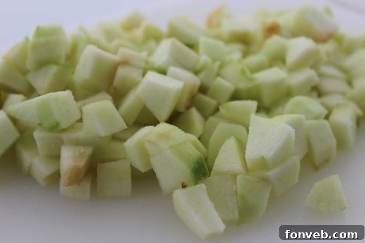 Cream cheese filling being mixed until smooth and fluffy