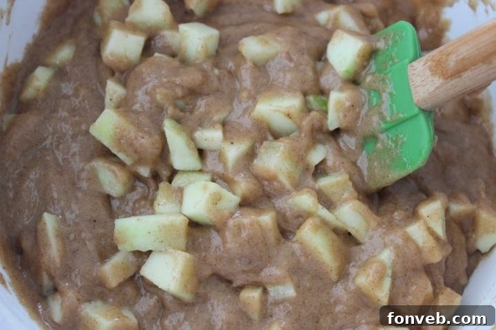 Bread batter layered with cream cheese filling in a loaf pan