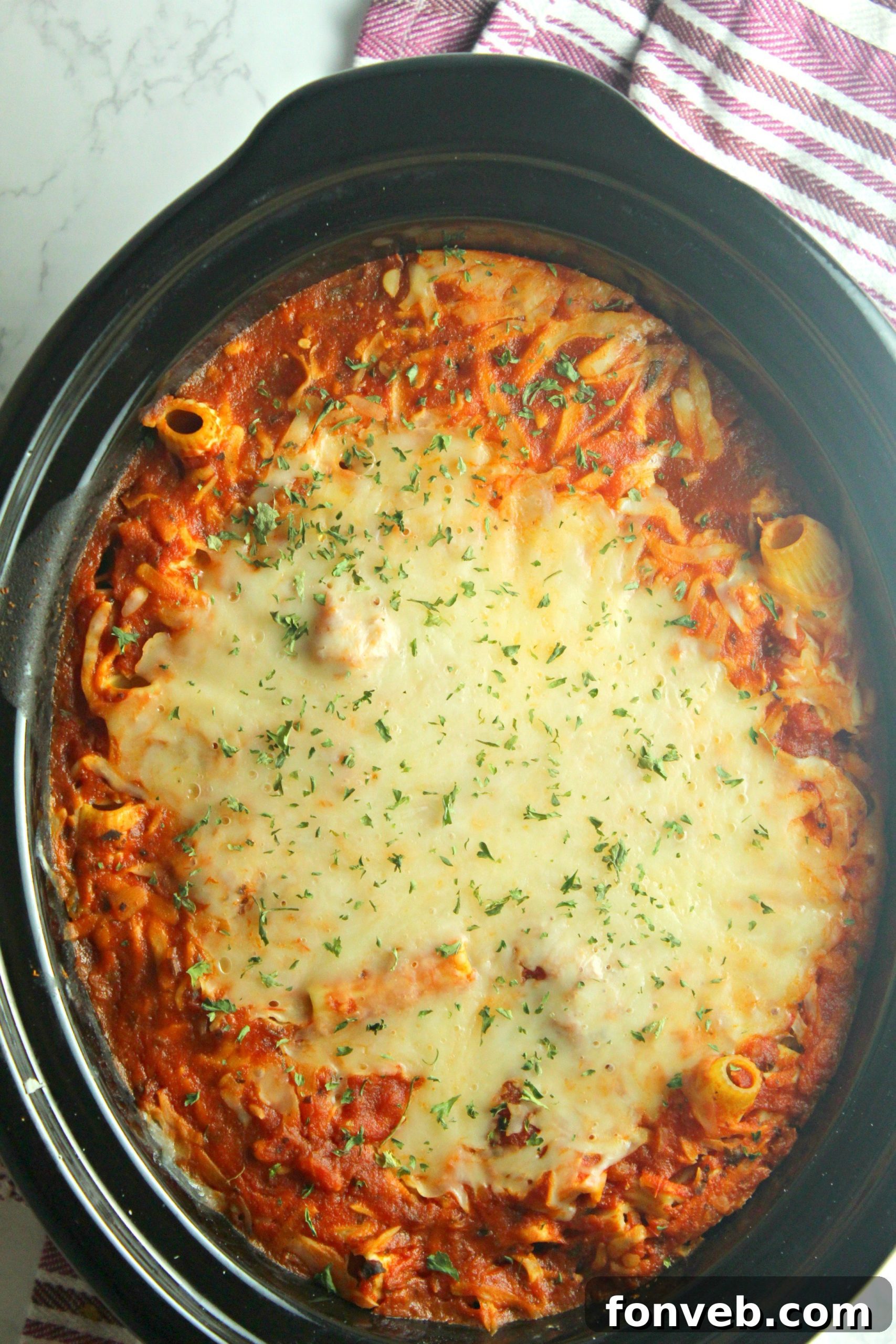 Close-up of slow cooker cheesy baked ziti