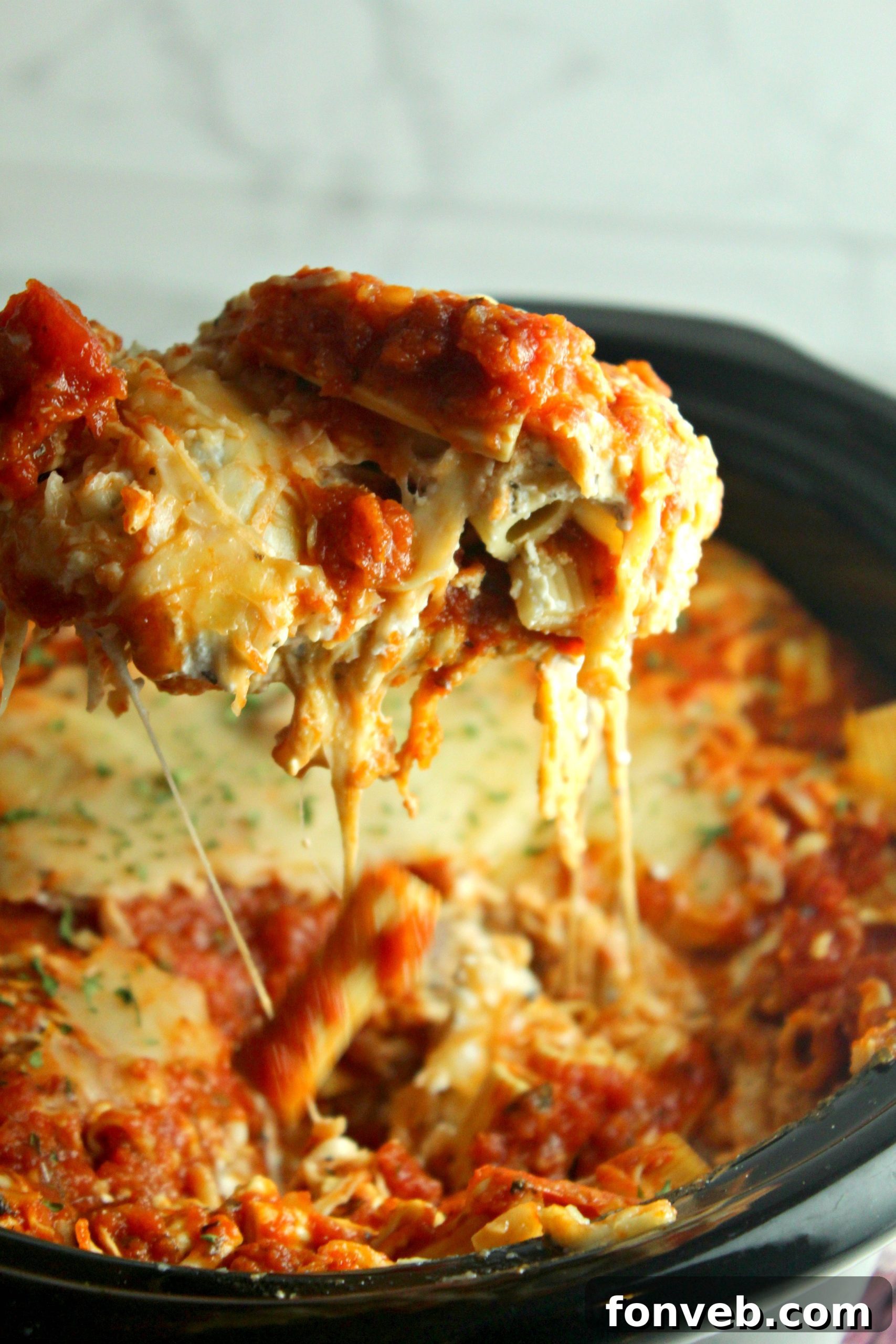 Overhead view of slow cooker cheesy baked ziti