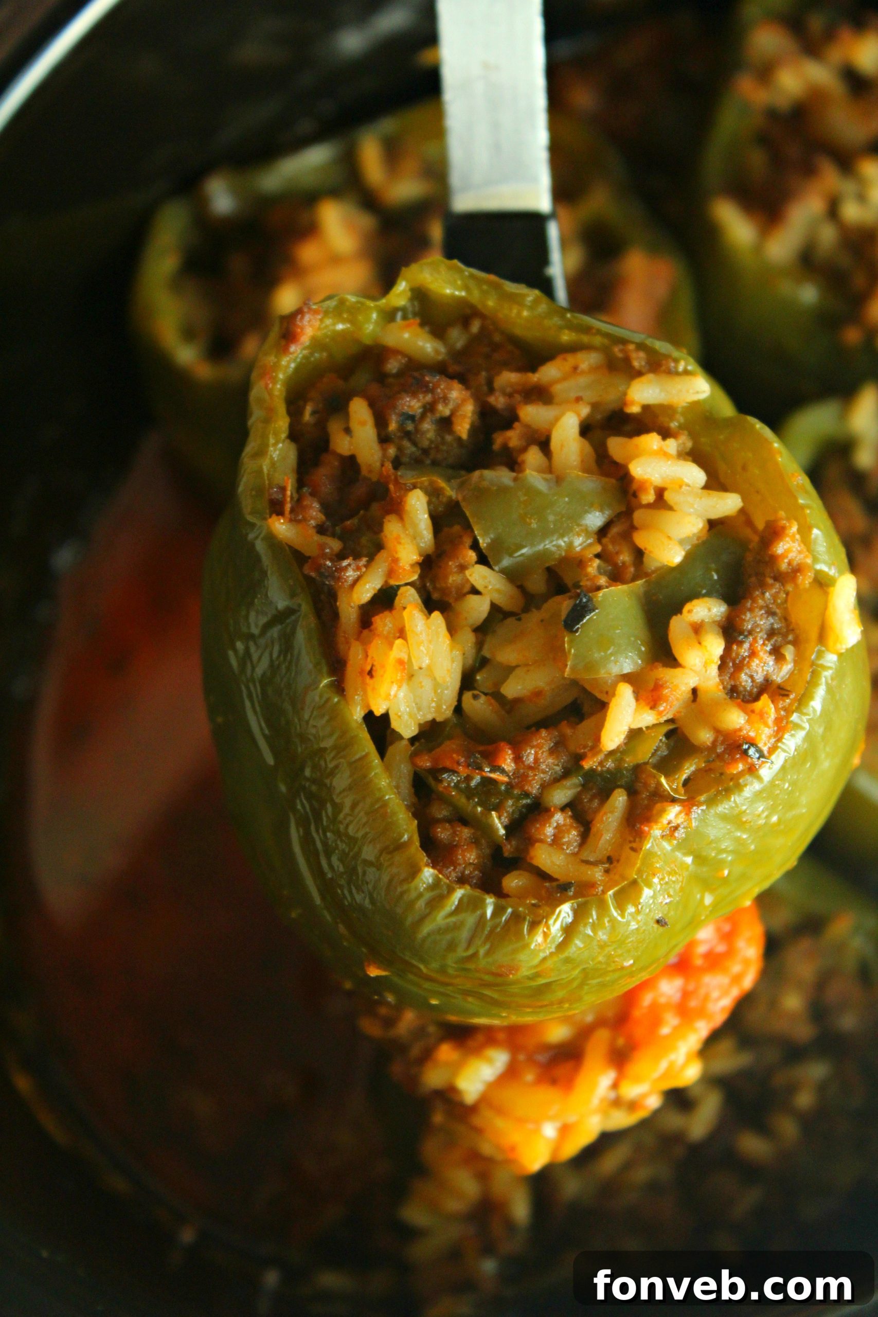 Slow Cooker Stuffed Peppers served in a bowl, showing the cross-section of the pepper and the savory filling.