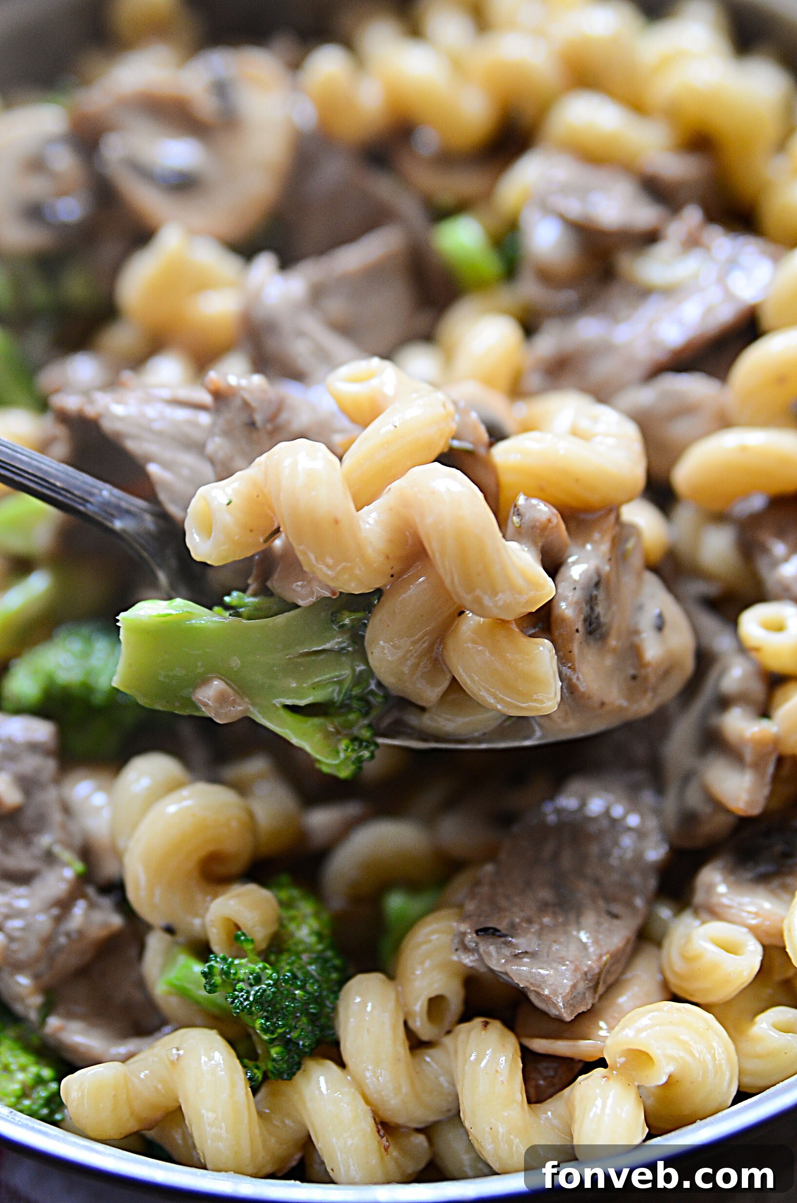 Hearty Beef, Mushroom & Broccoli Pasta 2 A large skillet filled with creamy Beef, Mushroom, and Broccoli Pasta, garnished with fresh parsley.