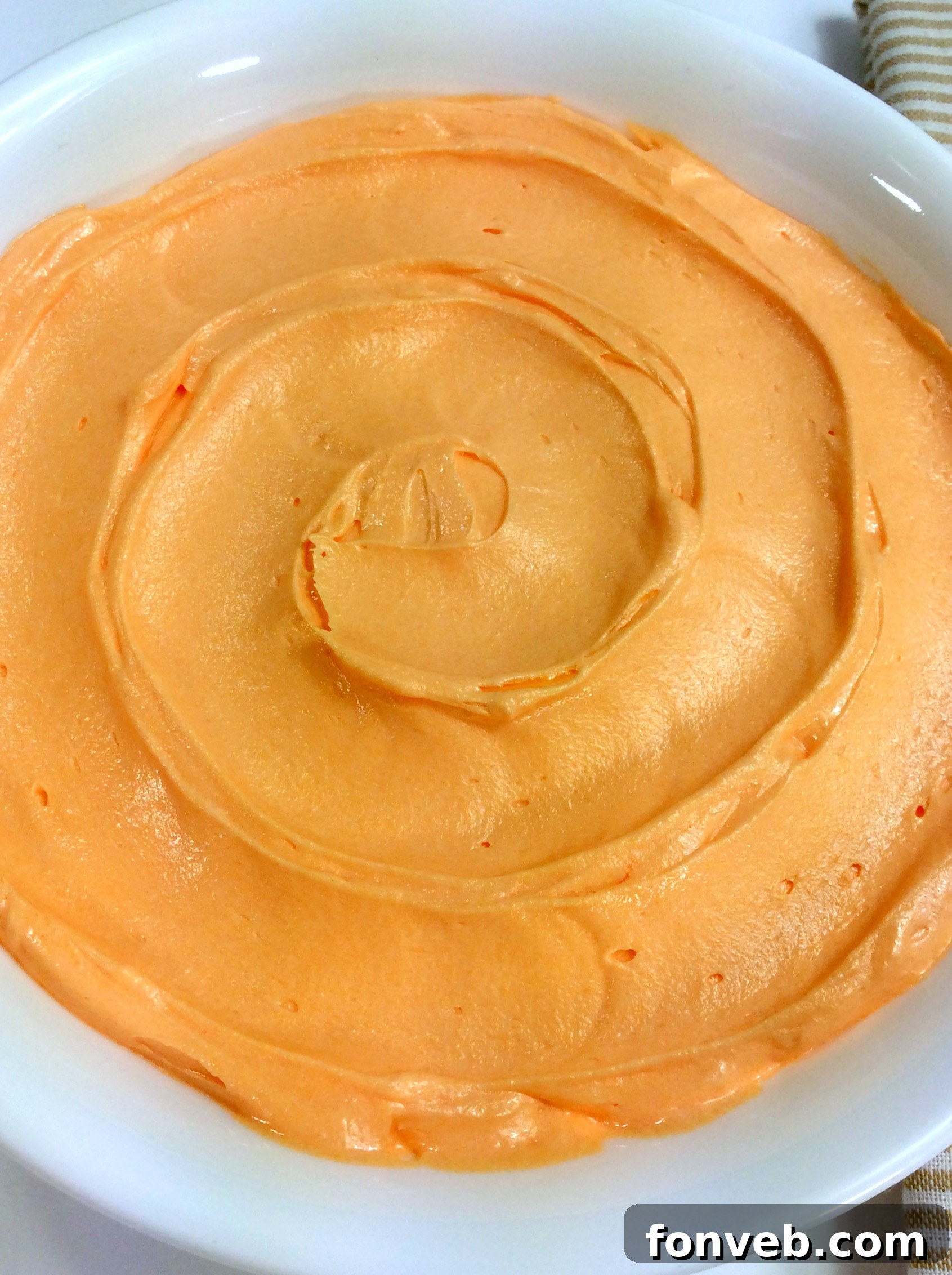 Another view of the orange creamsicle buttercream, showcasing its smooth texture.