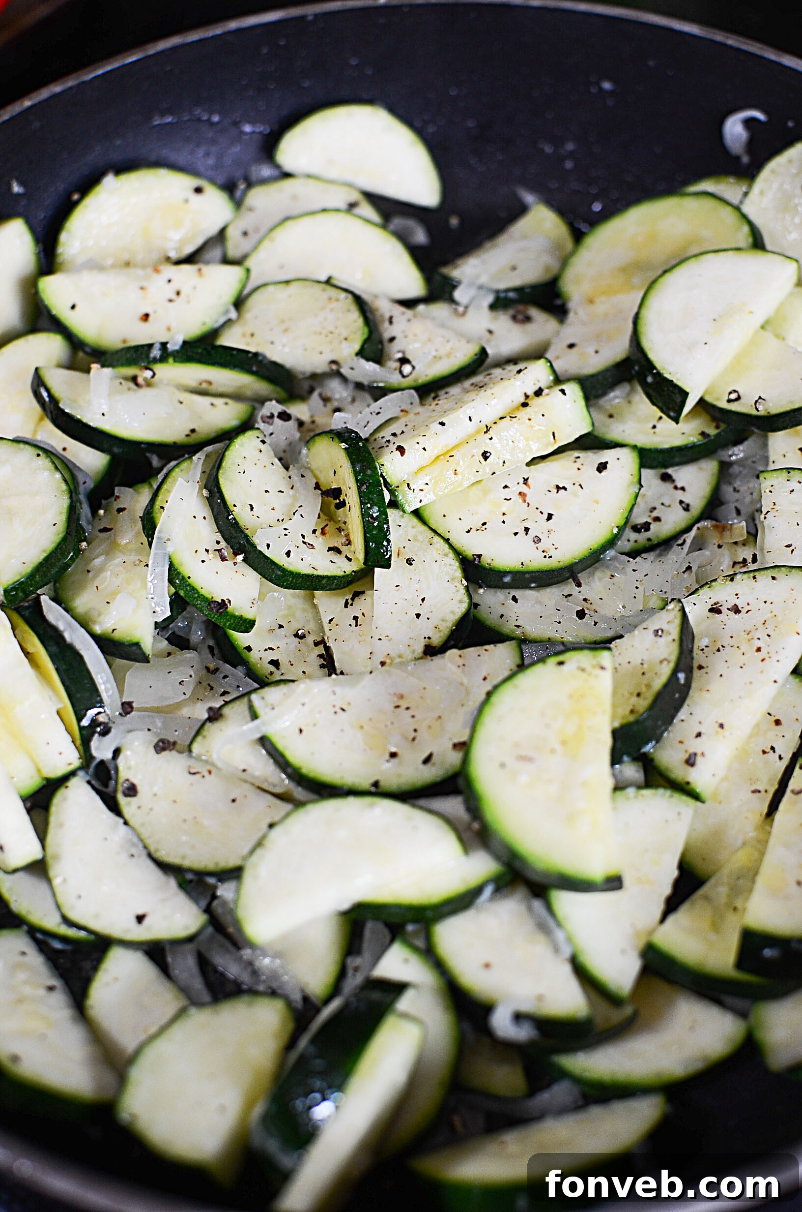 Freshly cooked Cheesy Zucchini Gratin in a rustic oven-safe skillet, vibrant and appealing
