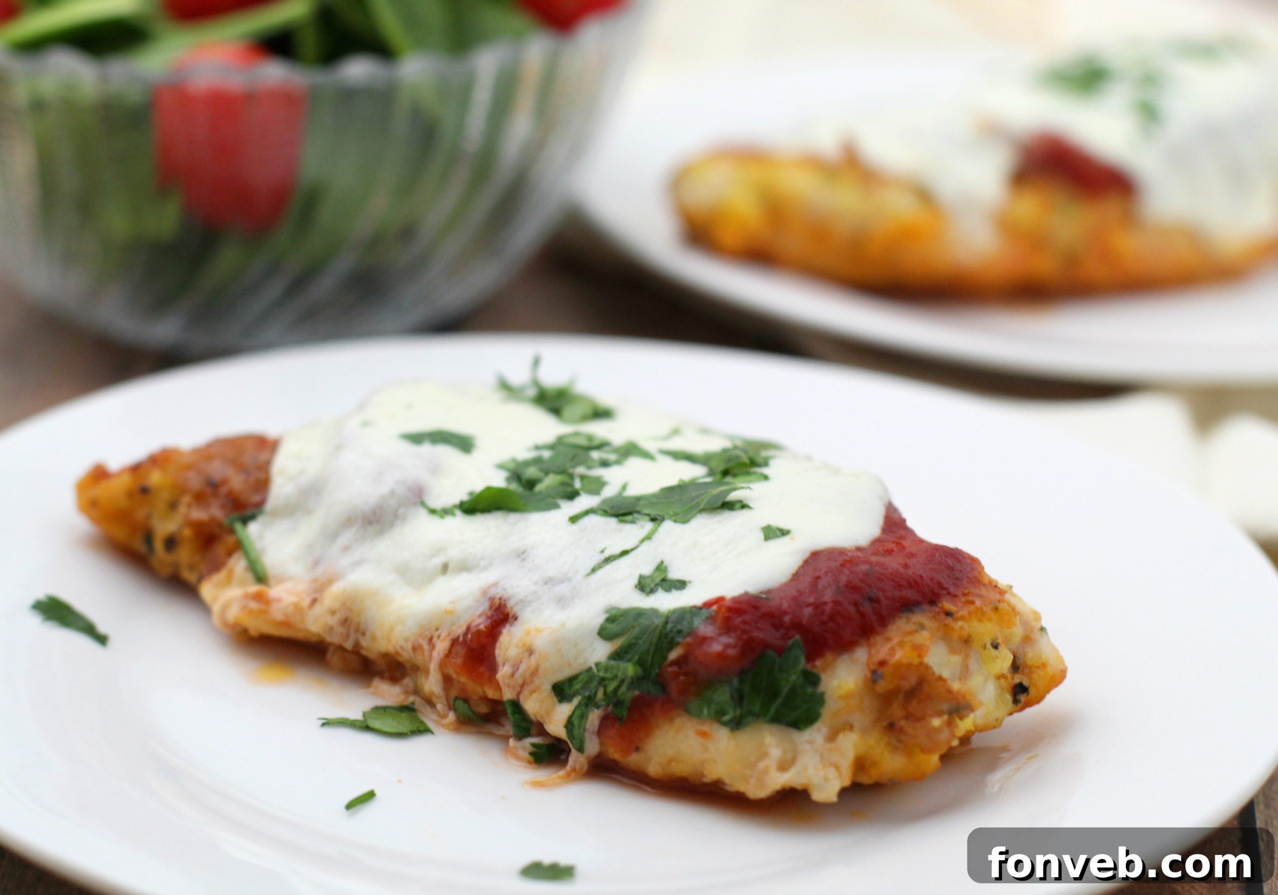 Keto Chicken Parmesan in a baking dish, fresh from the oven.