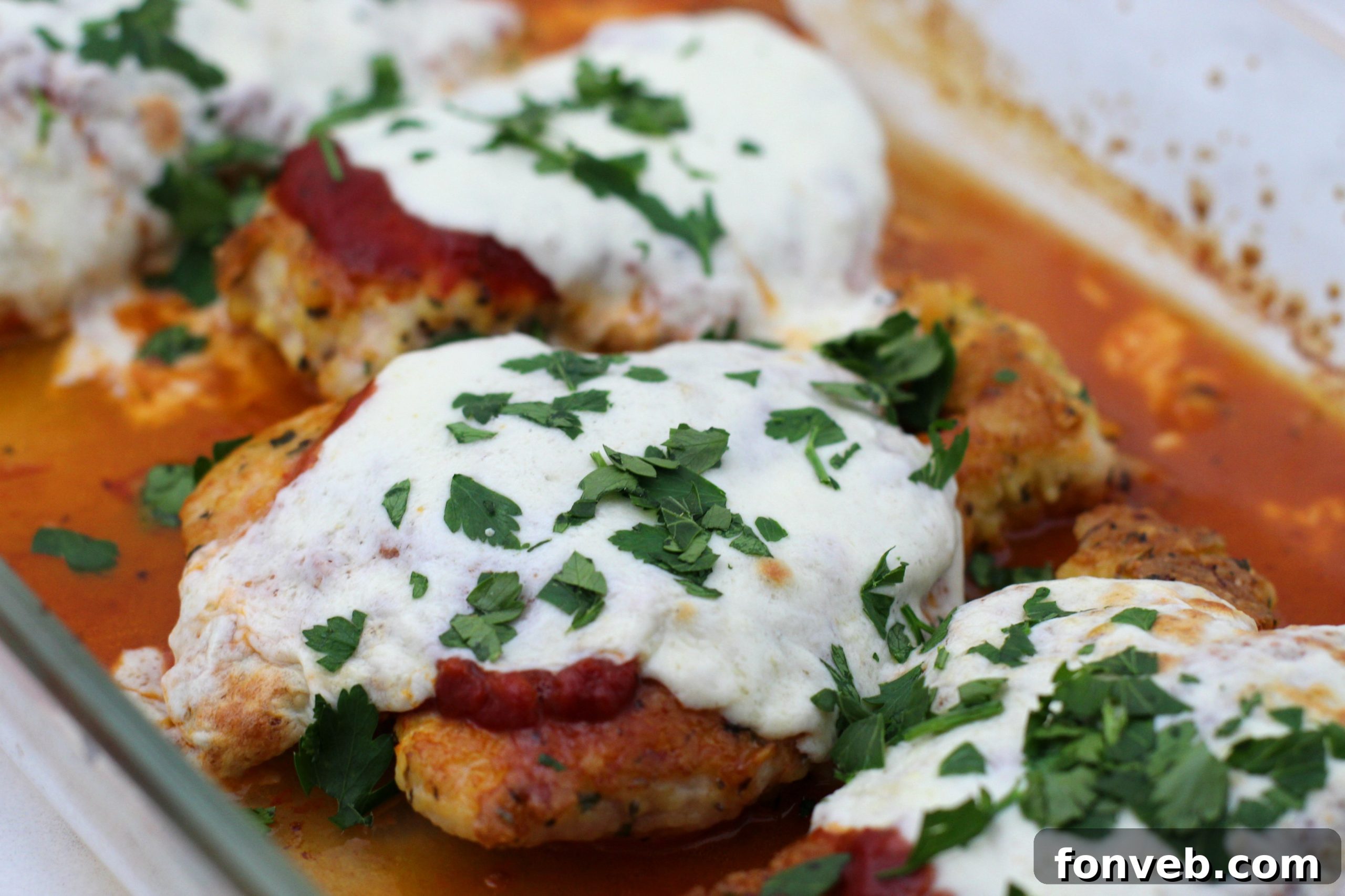 Multiple servings of Keto Chicken Parmesan on a platter.