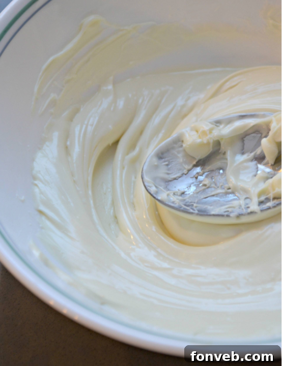 Plain white cream cheese fudge without food coloring, showcasing its creamy texture