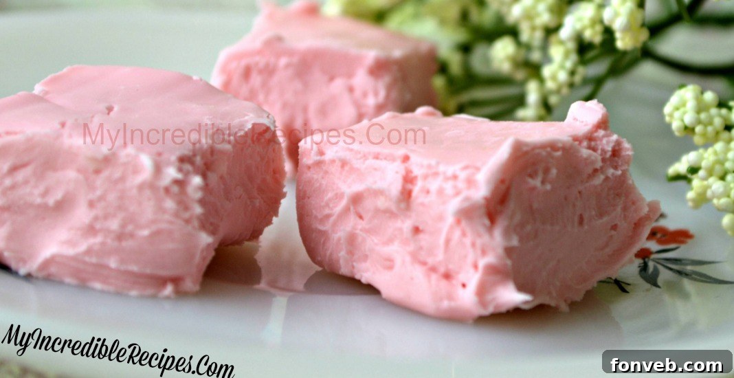 A tray of freshly made cream cheese fudge, some pieces already taken