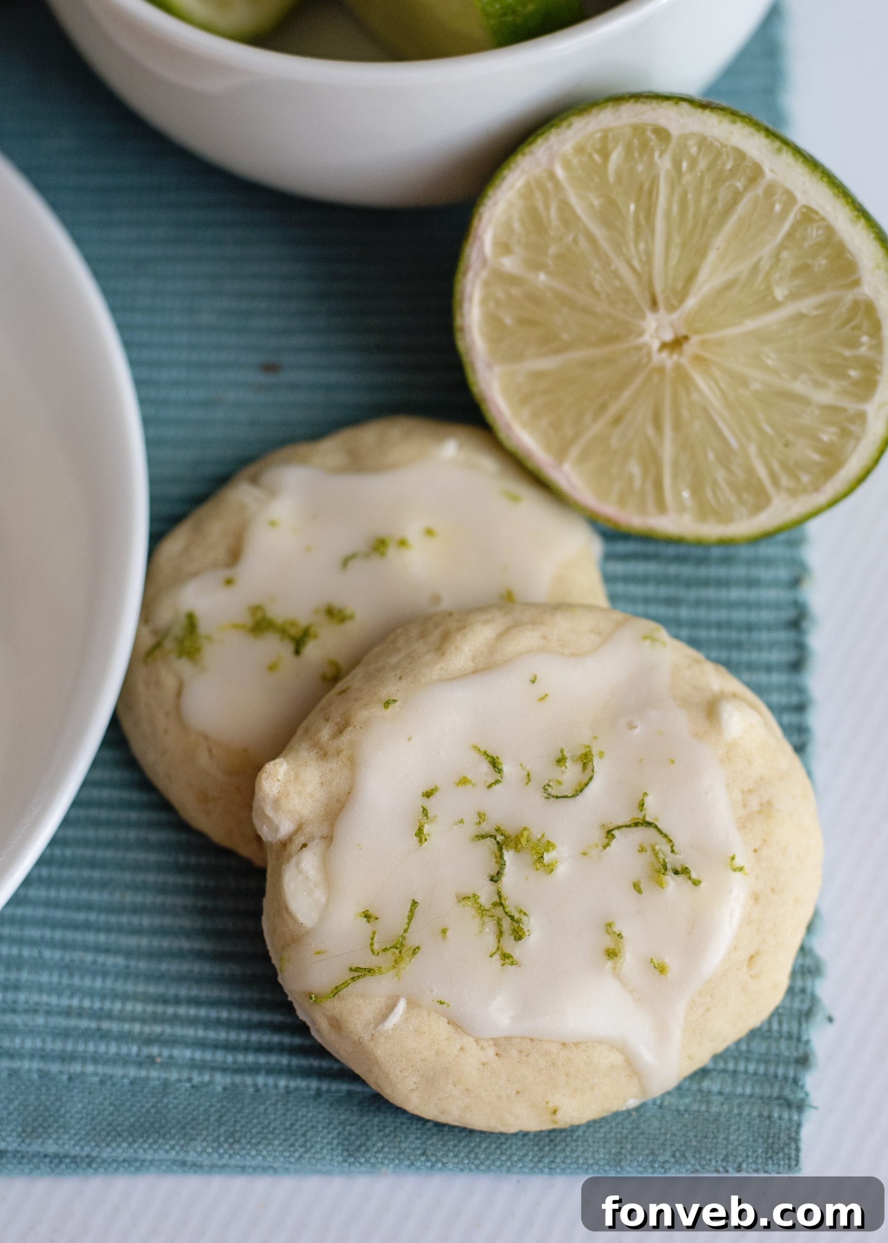 Close-up of Key Lime Pie Cookies with a light glaze and lime zest on top