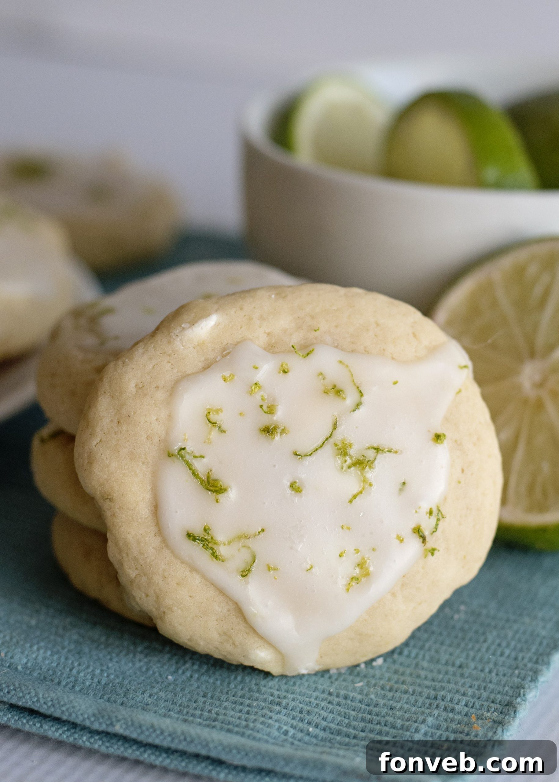 A slice of bread next to cookies in an airtight container, demonstrating the freshness tip