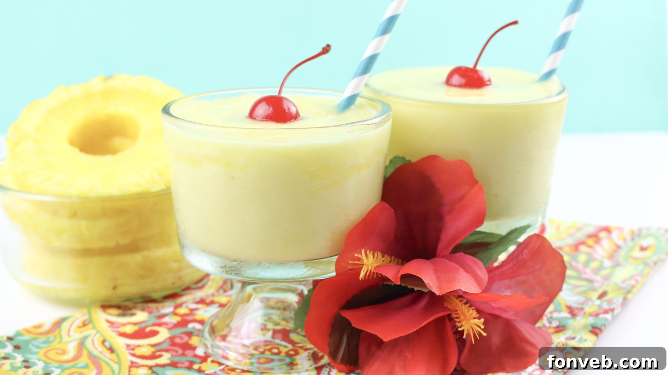 Disney's Tropical Pineapple Whip 4 Overhead shot of two glasses of homemade Dole Whip, ready to be enjoyed