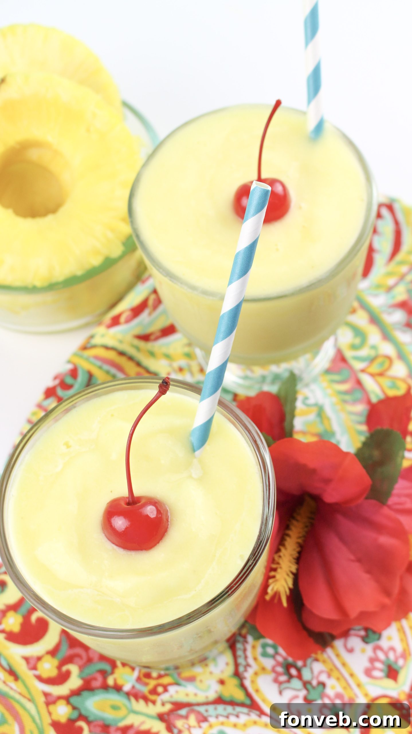 Disney's Tropical Pineapple Whip 6 A generous serving of Dole Whip with a spoon, highlighting its inviting texture