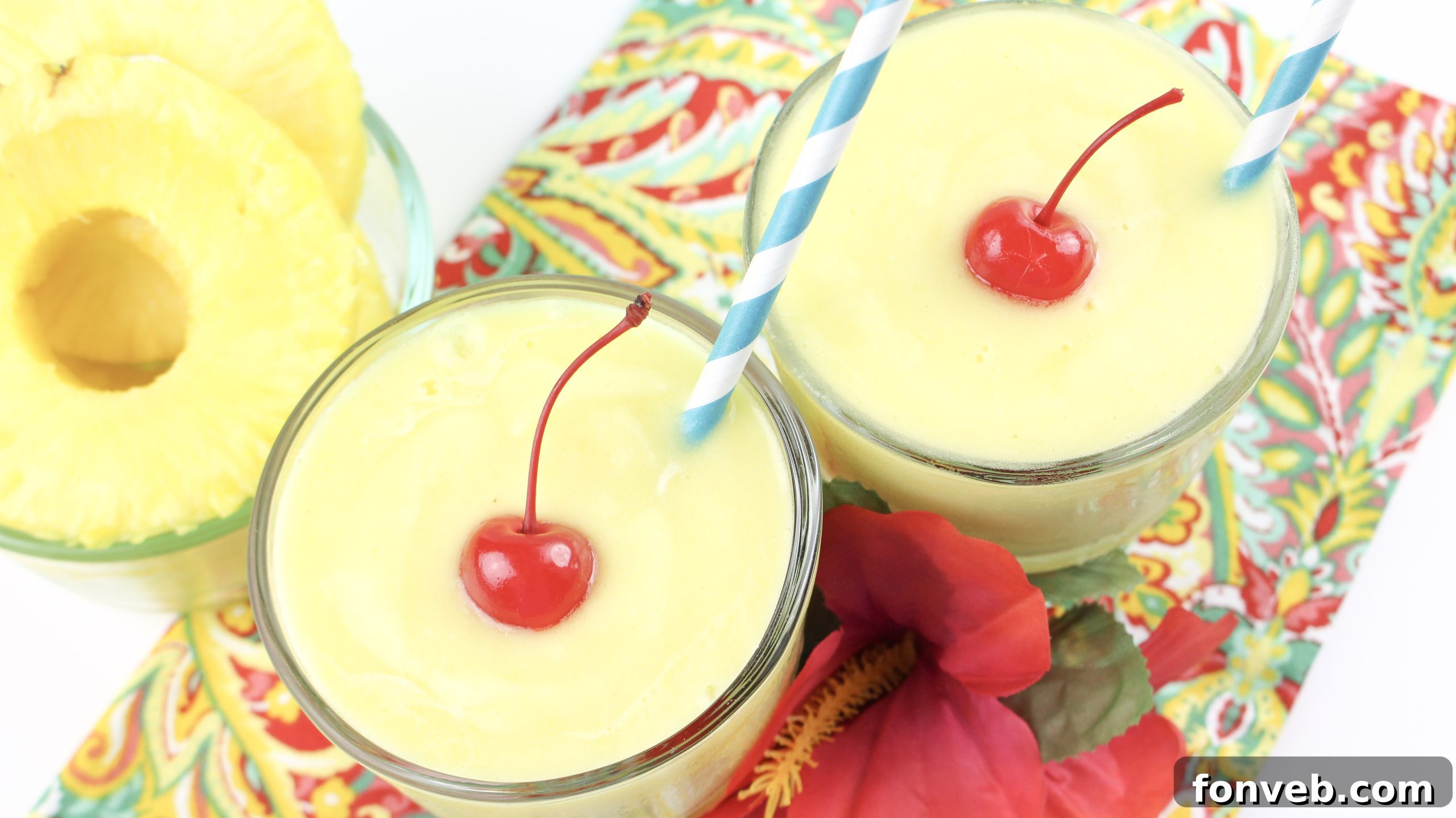 Disney's Tropical Pineapple Whip 7 Two glasses of homemade Dole Whip garnished with fresh pineapple wedges and cherries