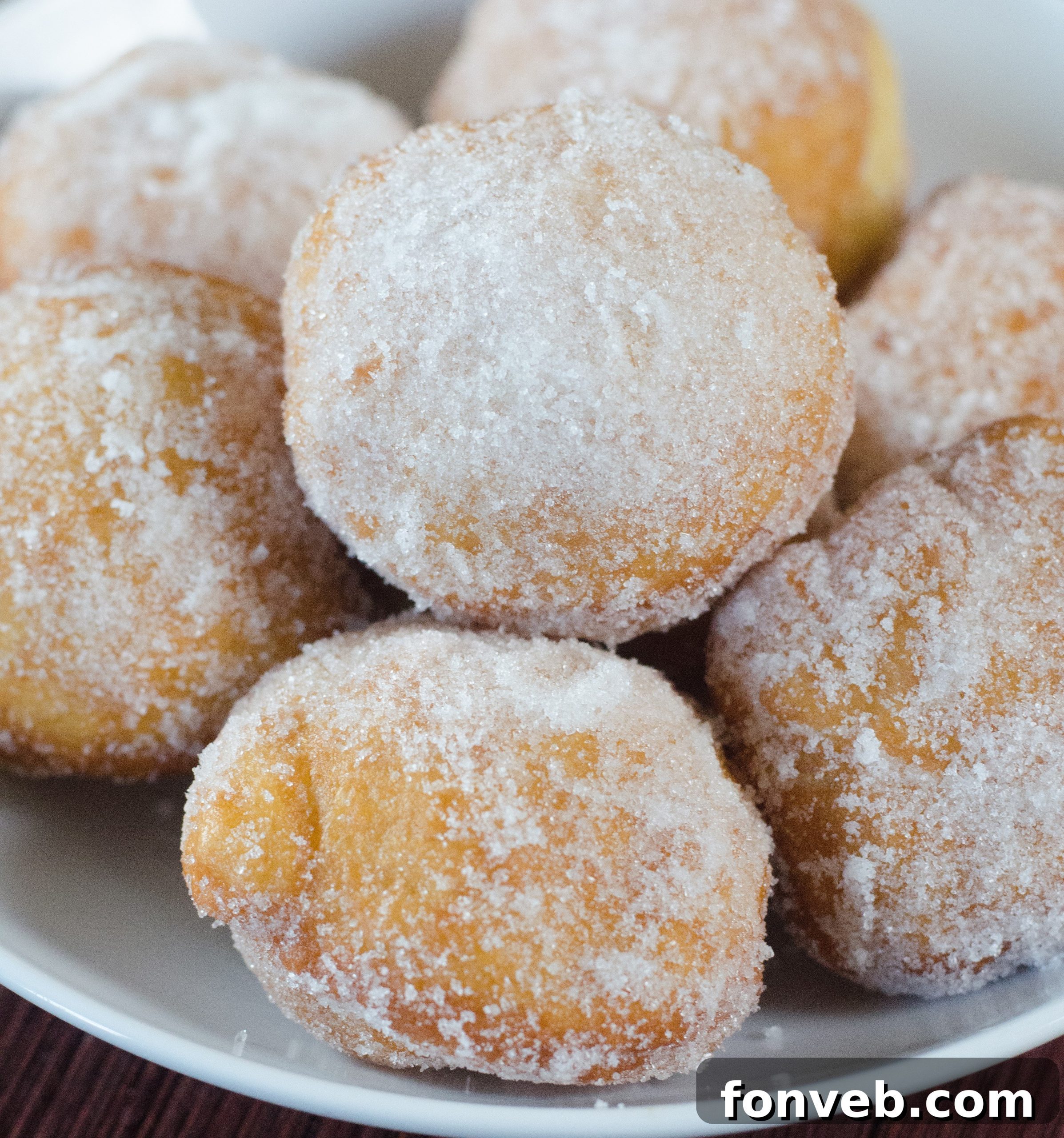 Chinese Fried Doughnuts 2 Delicious homemade Chinese sugar donuts piled high, glistening with sugar crystals.