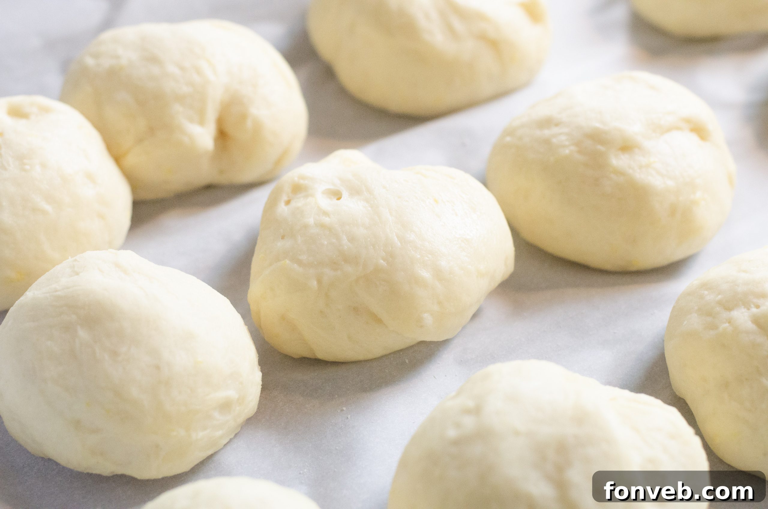 Chinese Fried Doughnuts 3 Close-up of golden brown Chinese sugar donuts cooling on a rack, freshly fried.