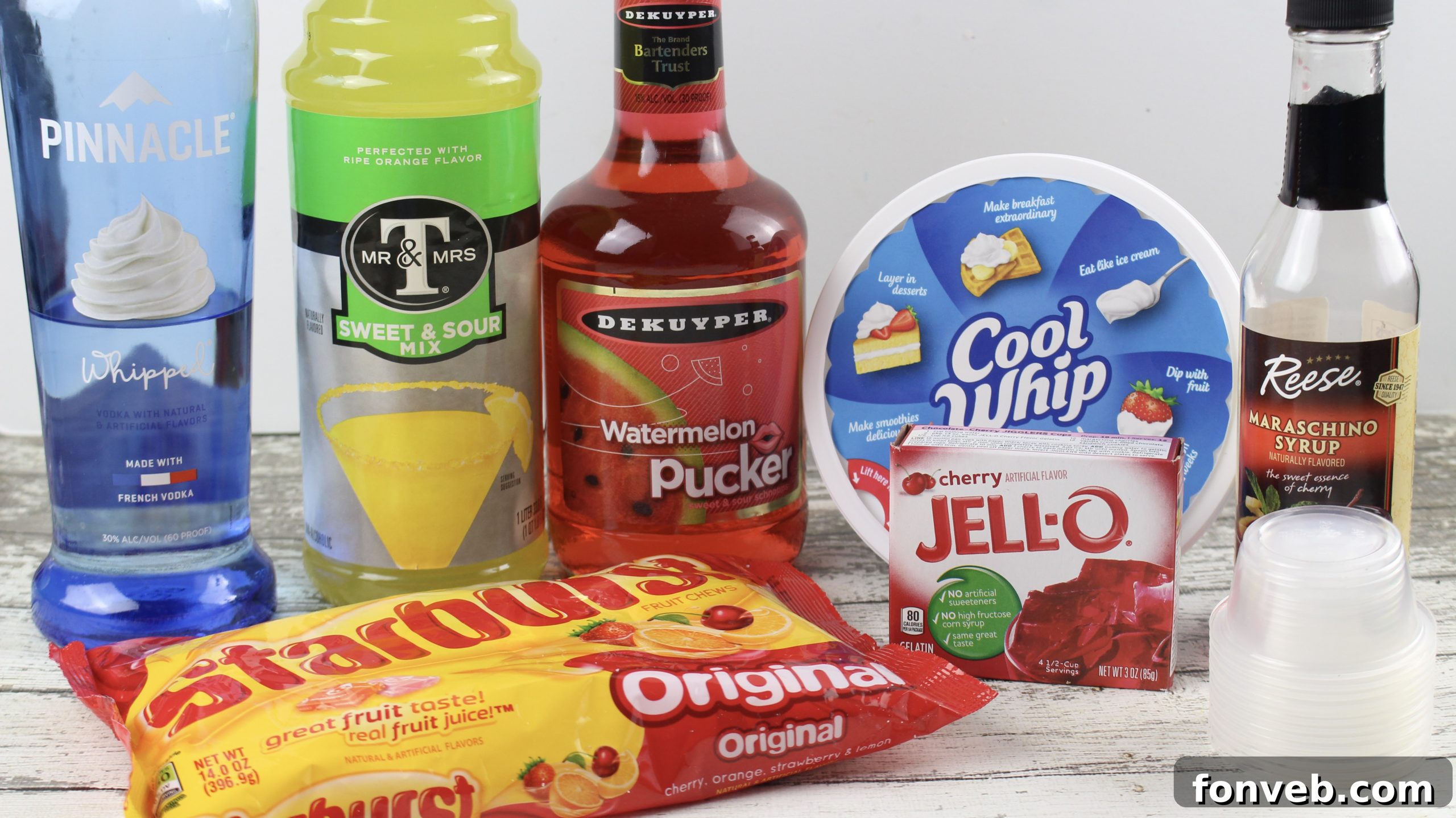 A tray filled with colorful Cherry Starburst Jell-O Shots, ready for a party.