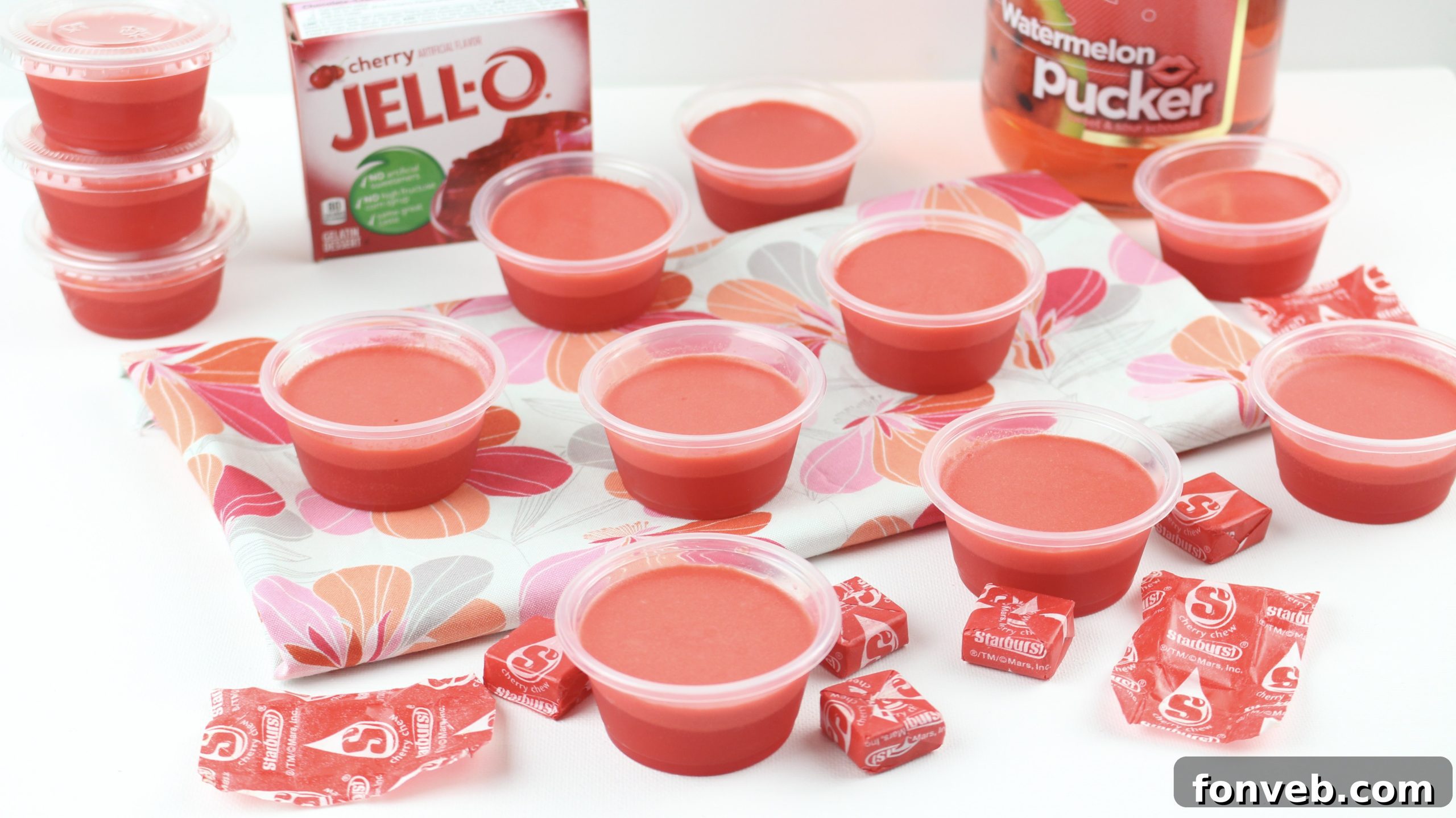 A collection of Cherry Starburst Jell-O Shots arranged attractively on a platter, ready for guests.