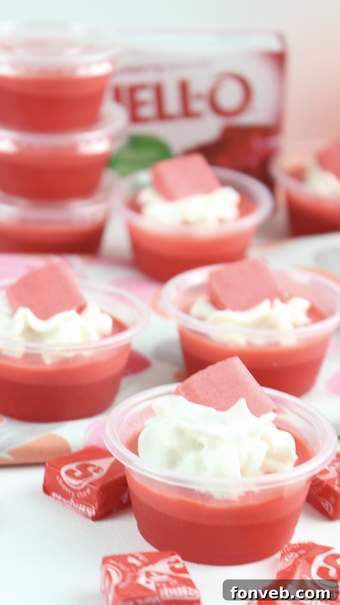 A closer view of Cherry Starburst Jell-O Shots, highlighting their smooth texture and vibrant color.