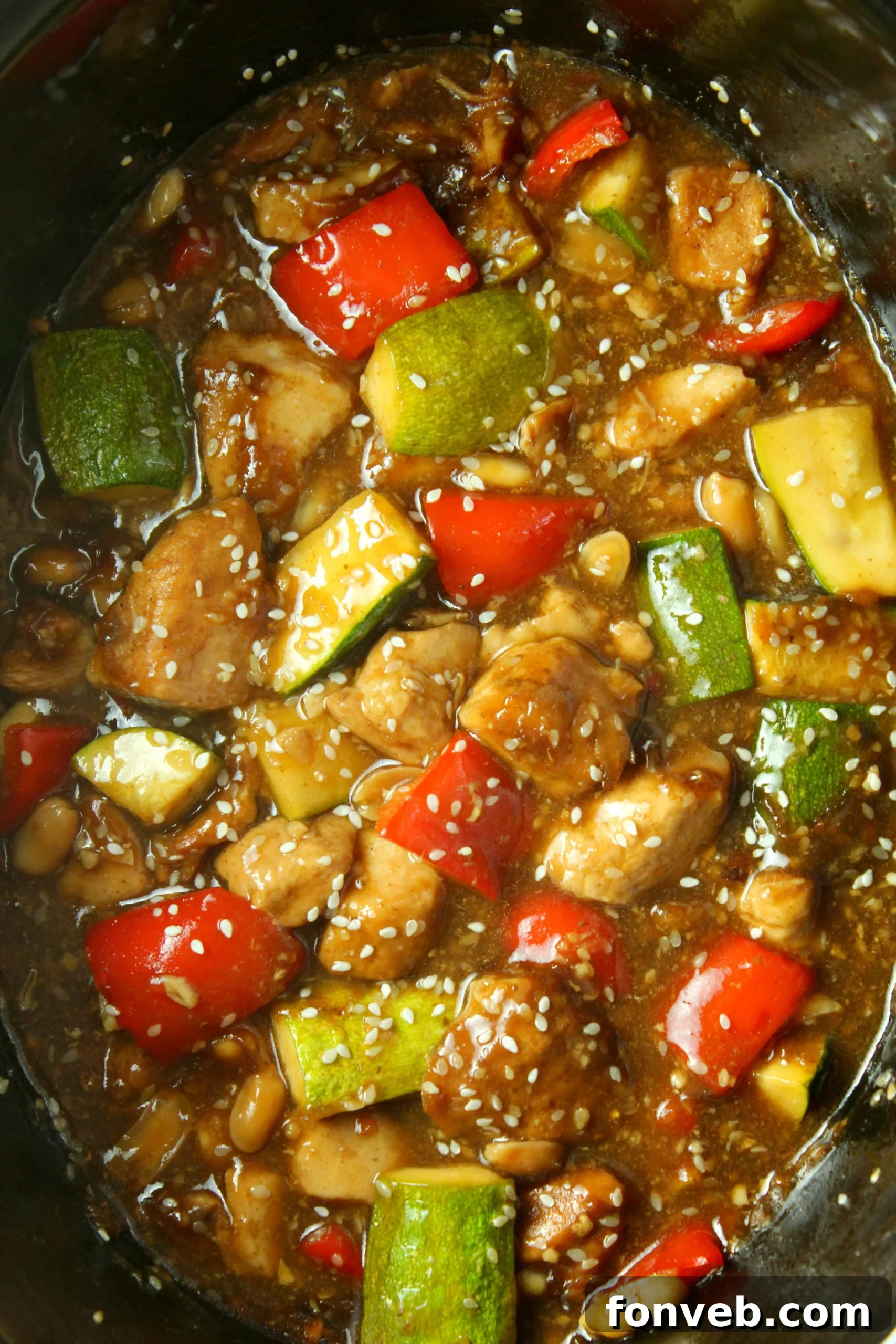 Delicious Slow Cooker Kung Pao Chicken with juicy chicken, peanuts, and vegetables served in a bowl.