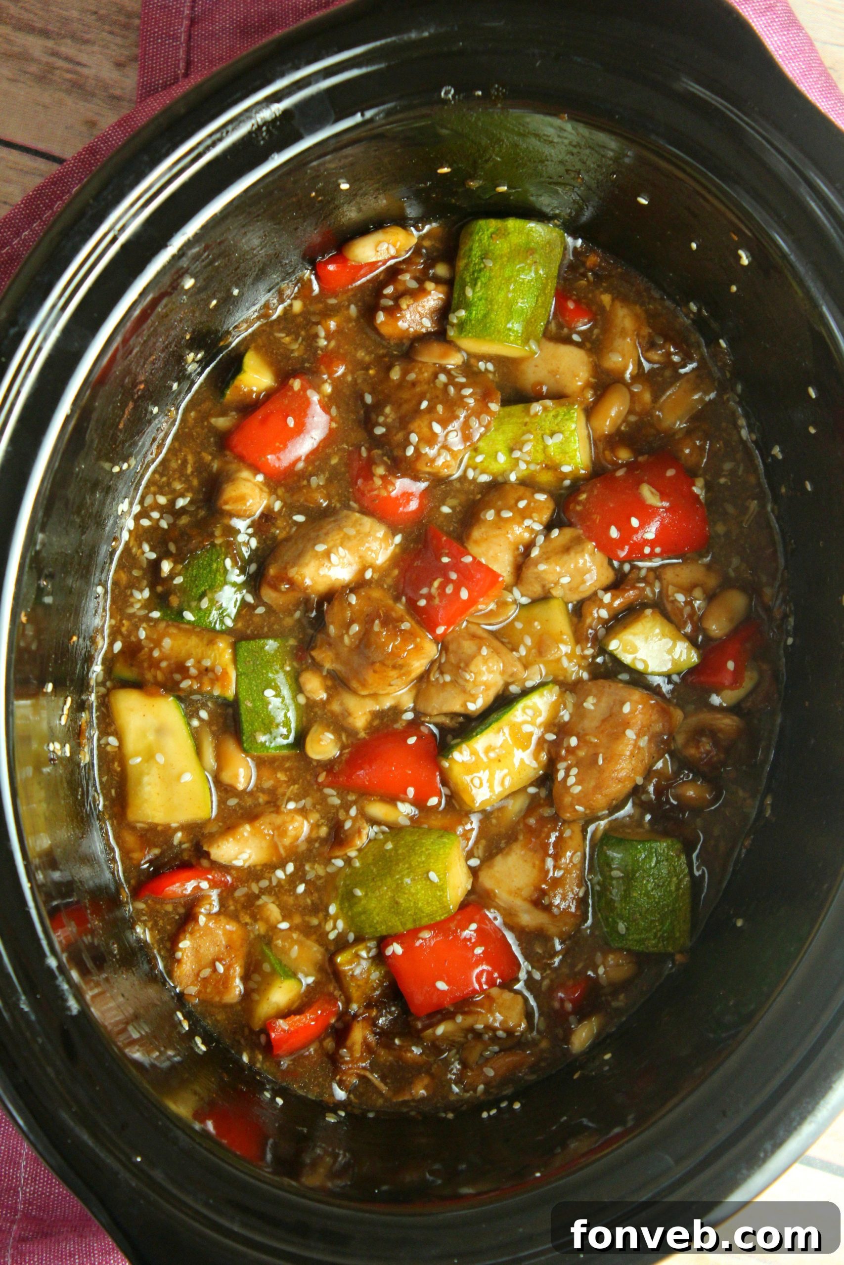 Close-up of Slow Cooker Kung Pao Chicken with tender chicken pieces, cashews, and red chili peppers.
