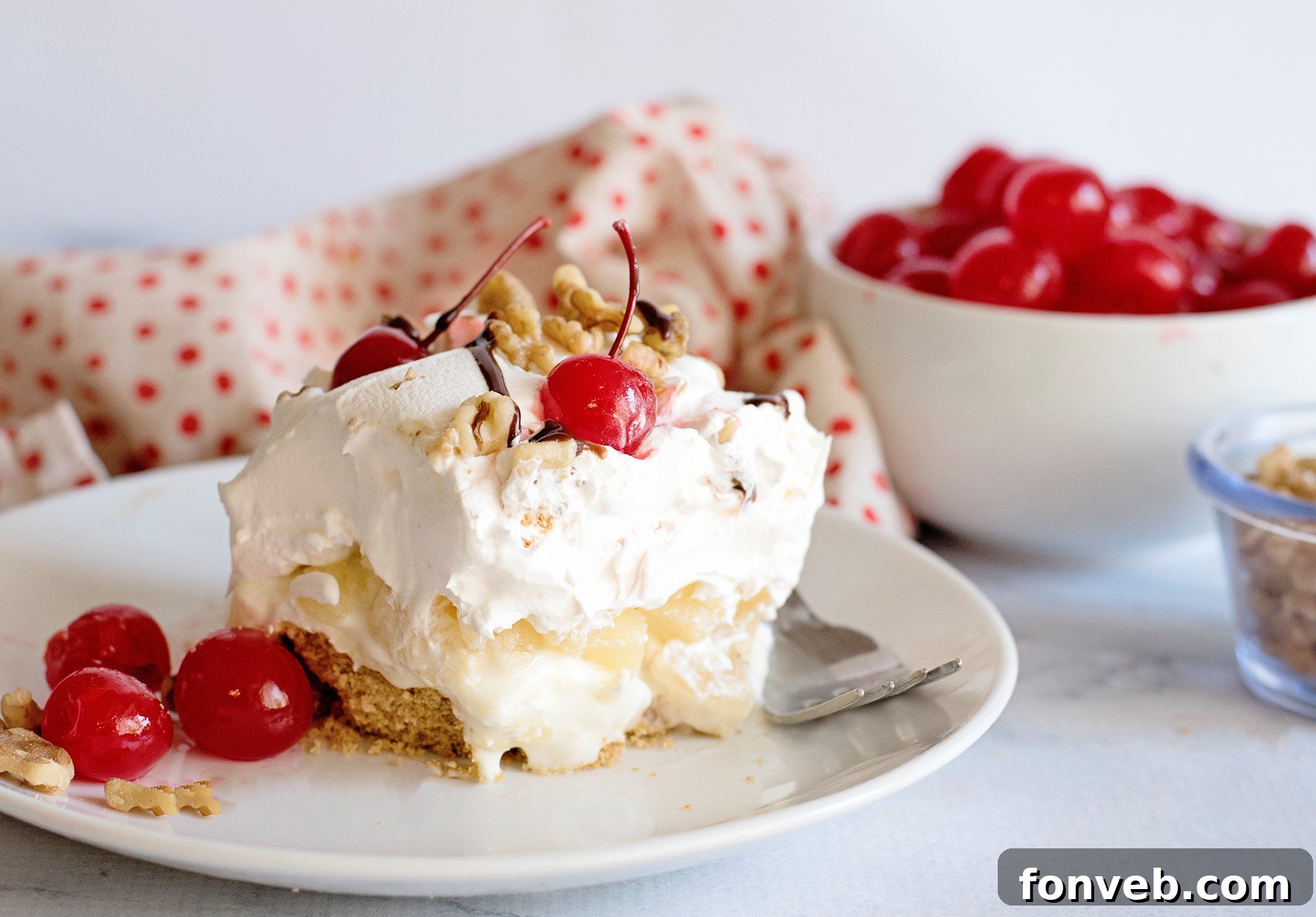 No Bake Banana Split Dream 8 No-Bake Banana Split Dessert with a focus on its creamy layers and fresh banana slices, ready for a delicious treat.