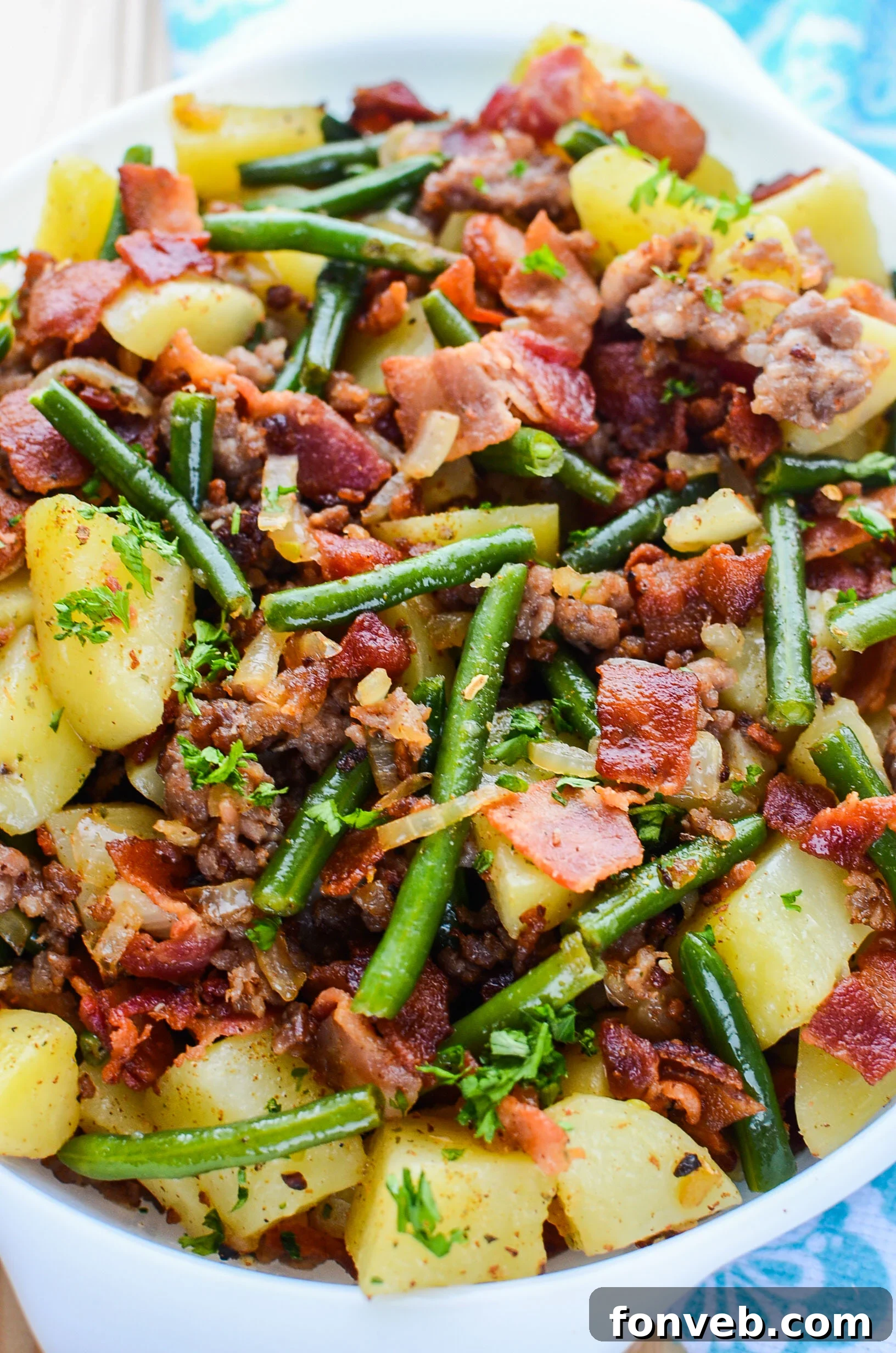 A final close-up of the piping hot Southern Sausage, Potatoes, and Green Beans, perfectly cooked.