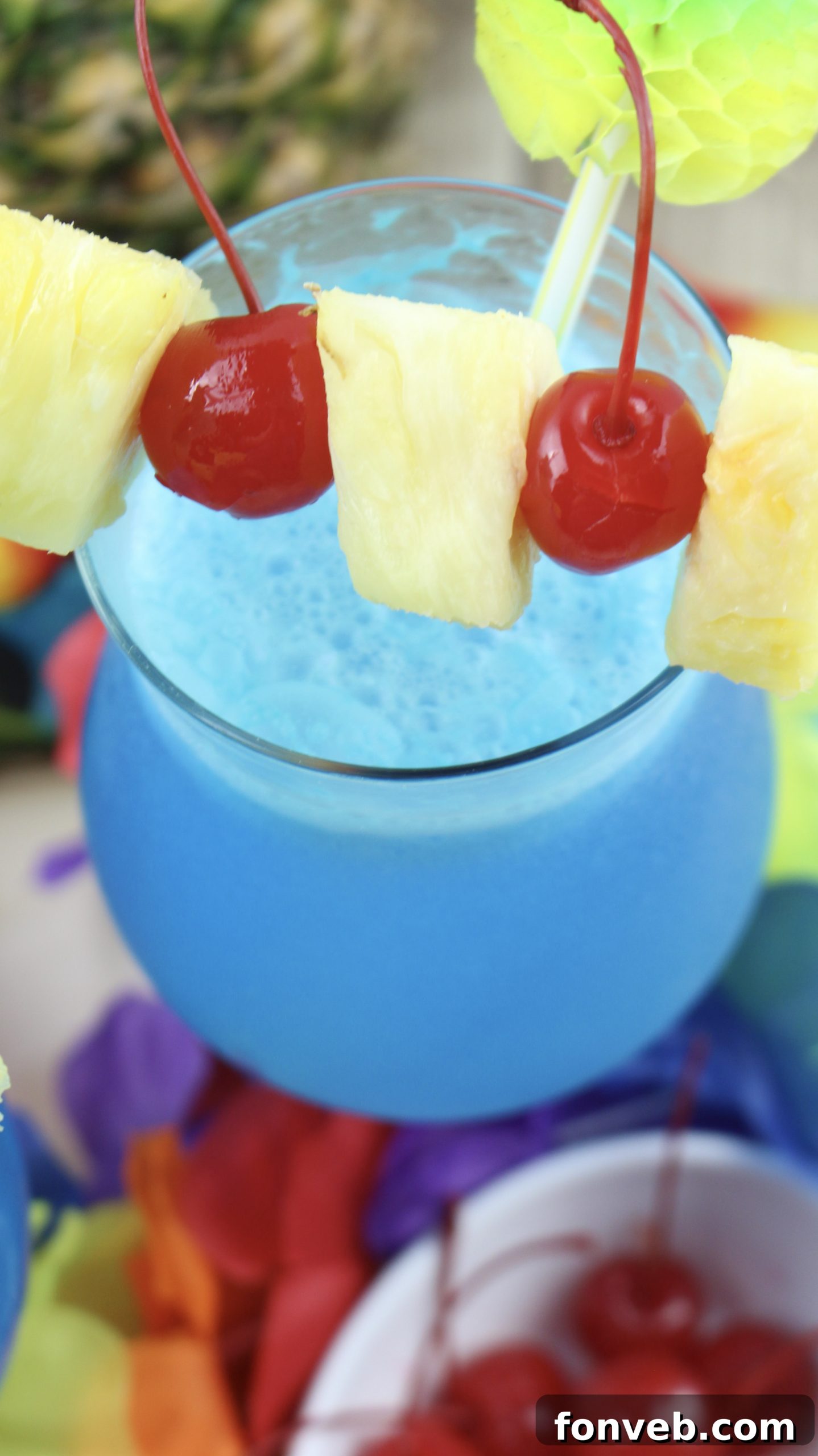 Blue Hawaiian Tropical Escape 11 A beautifully presented Blue Hawaiian cocktail on a light-colored surface.