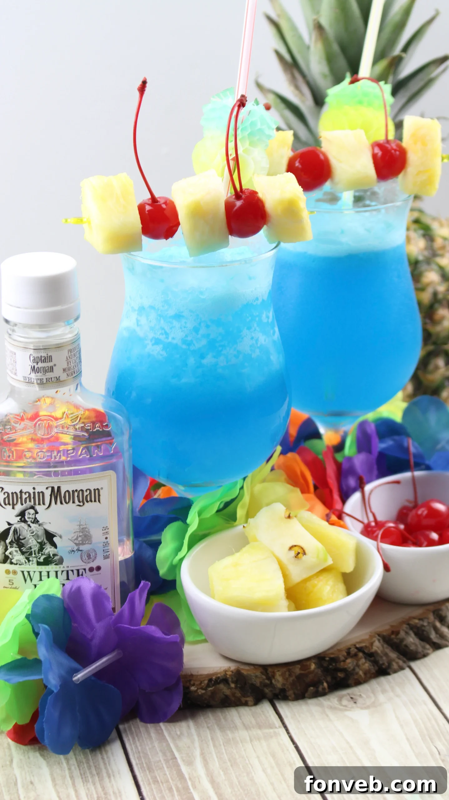 Blue Hawaiian Tropical Escape 4 Two Blue Hawaiian cocktails, perfectly blended and ready to serve, symbolizing a taste of Hawaii.
