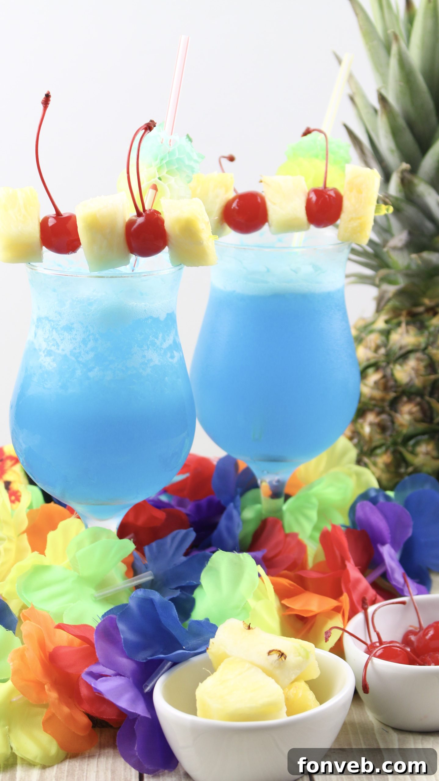 Blue Hawaiian Tropical Escape 7 A perfectly blended Blue Hawaiian cocktail being poured into a hurricane glass.