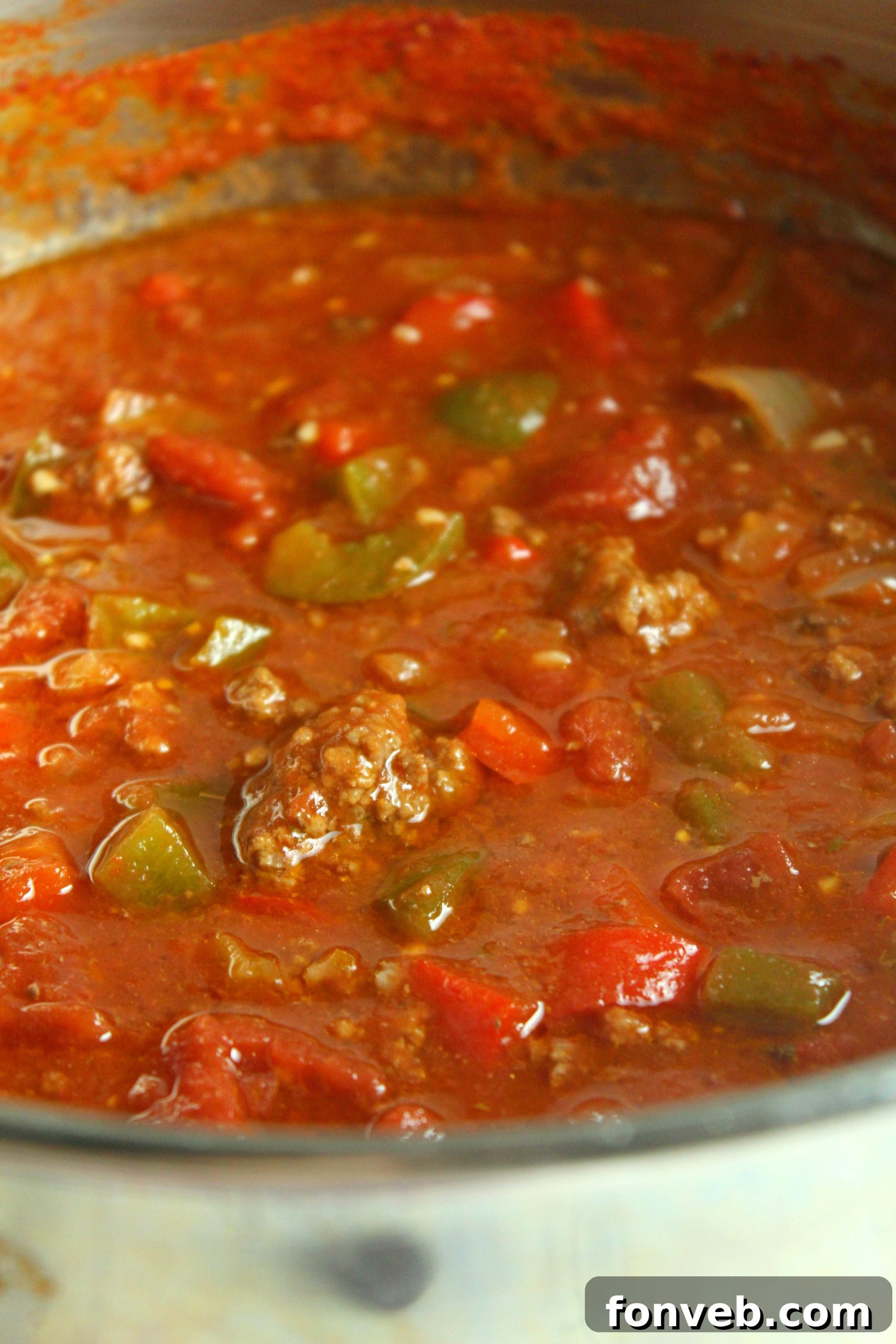 Rustic Stuffed Bell Pepper Soup 6 Another enticing view of the stuffed pepper soup in a bowl, with steam rising, highlighting its warmth and fresh parsley garnish.