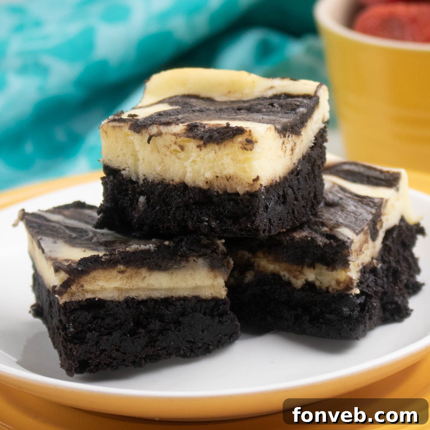 Homemade Cheesecake Swirl Brownies fresh from the oven, showing a beautiful swirl pattern.