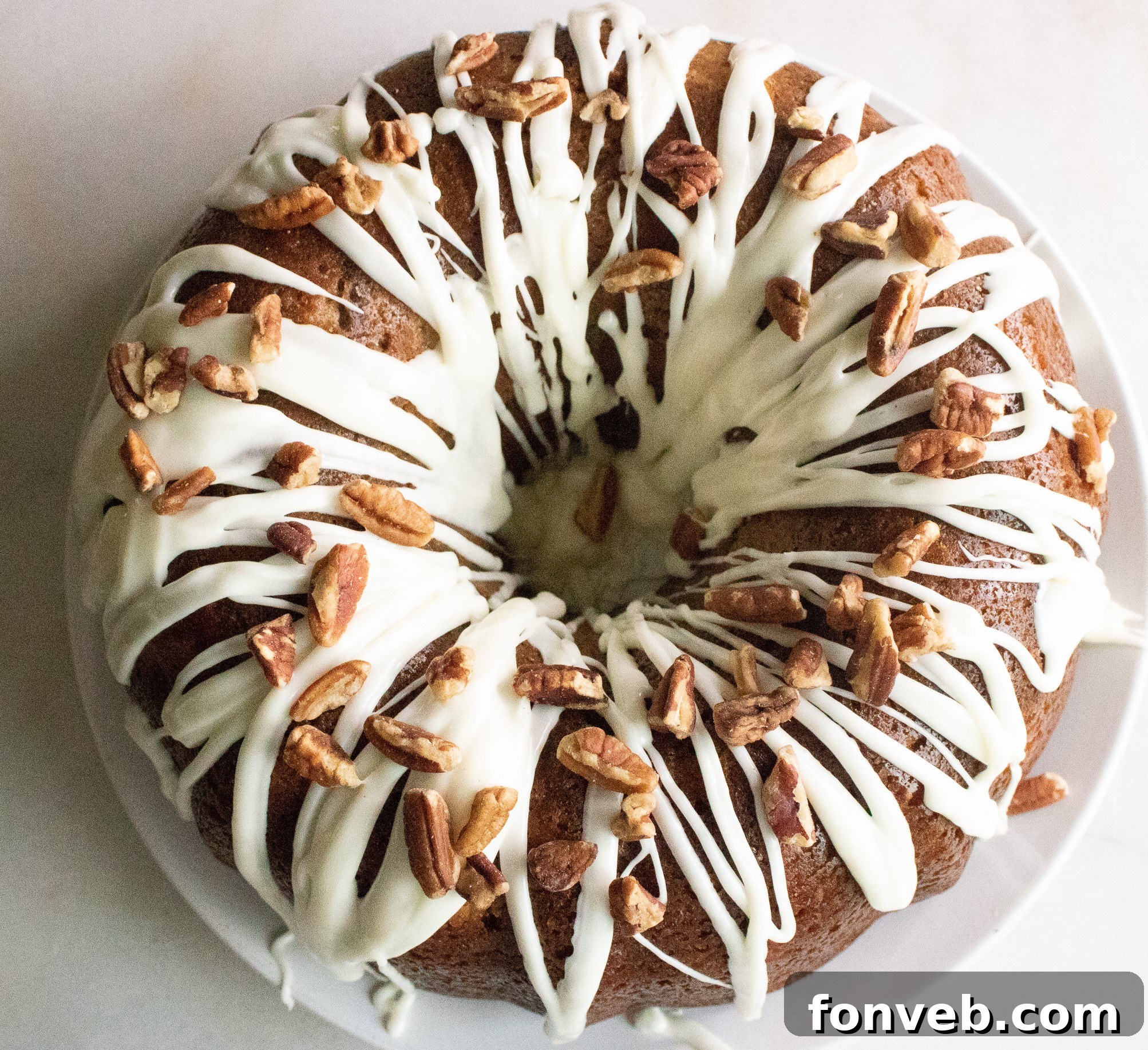 Close-up of a whole Southern Hummingbird Bundt Cake, golden brown and perfectly baked in a decorative Bundt pan