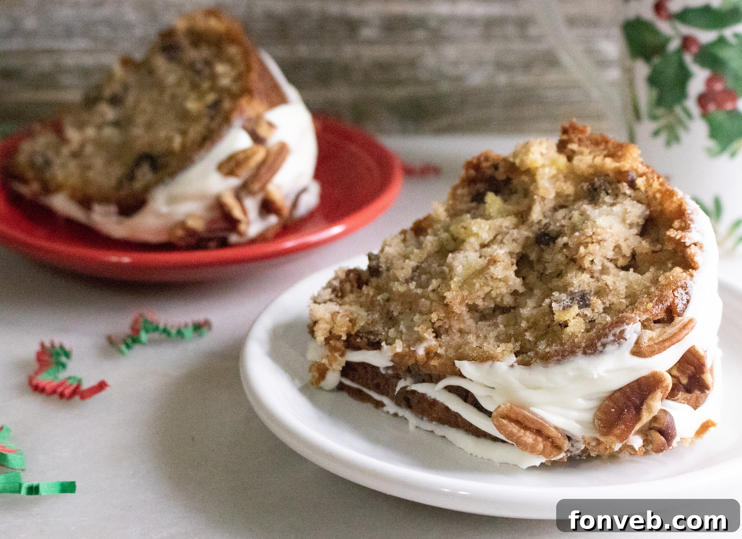 A beautifully decorated Southern Hummingbird Bundt Cake, showcasing the rich, moist texture inside with visible pineapple and banana pieces