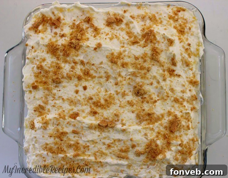 Close-up of a single portion of pineapple lush dessert on a fork