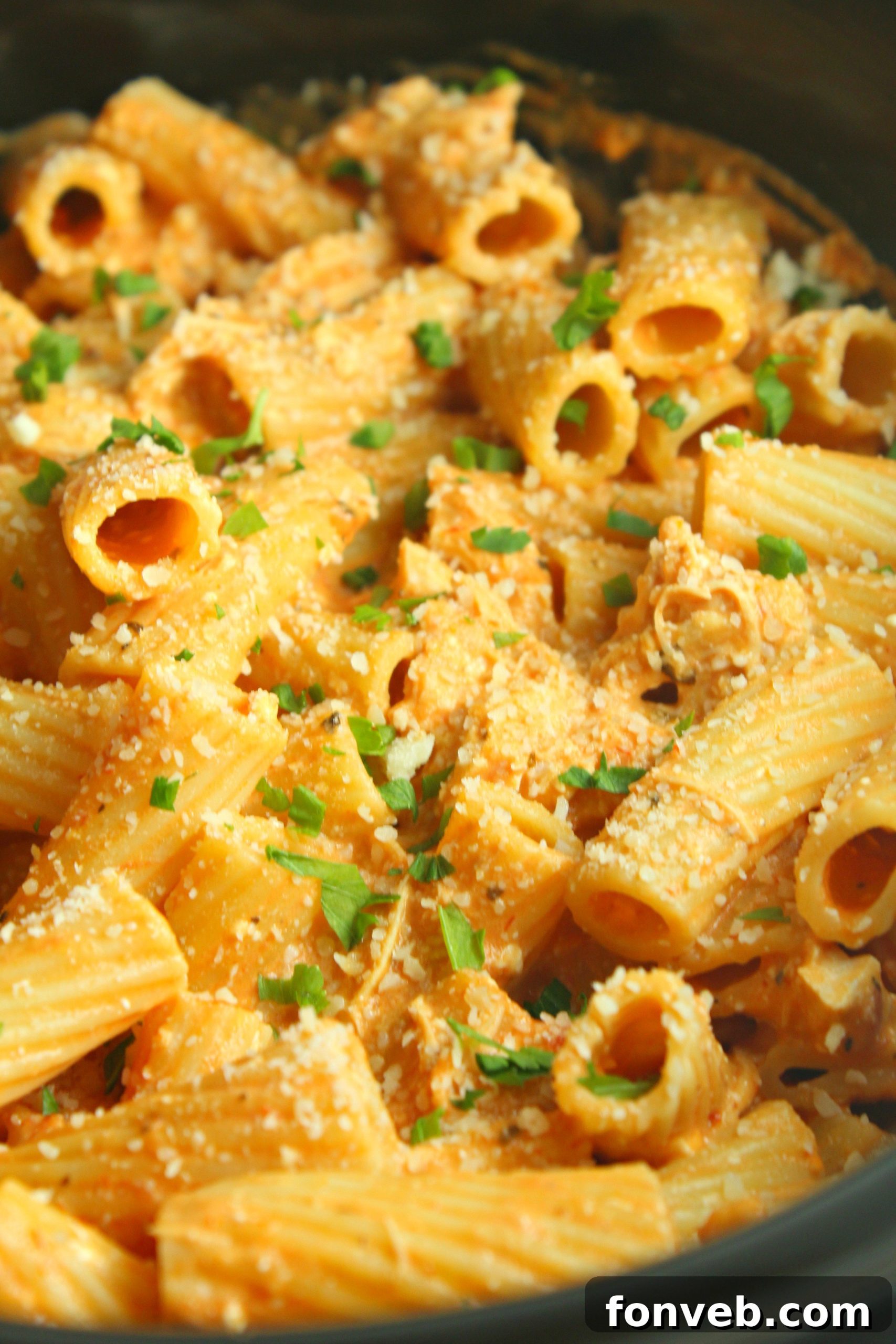 Velvety Slow Cooker Chicken Rigatoni 8 A side view of the rigatoni, showing the creamy sauce coating each pasta tube and chicken piece.