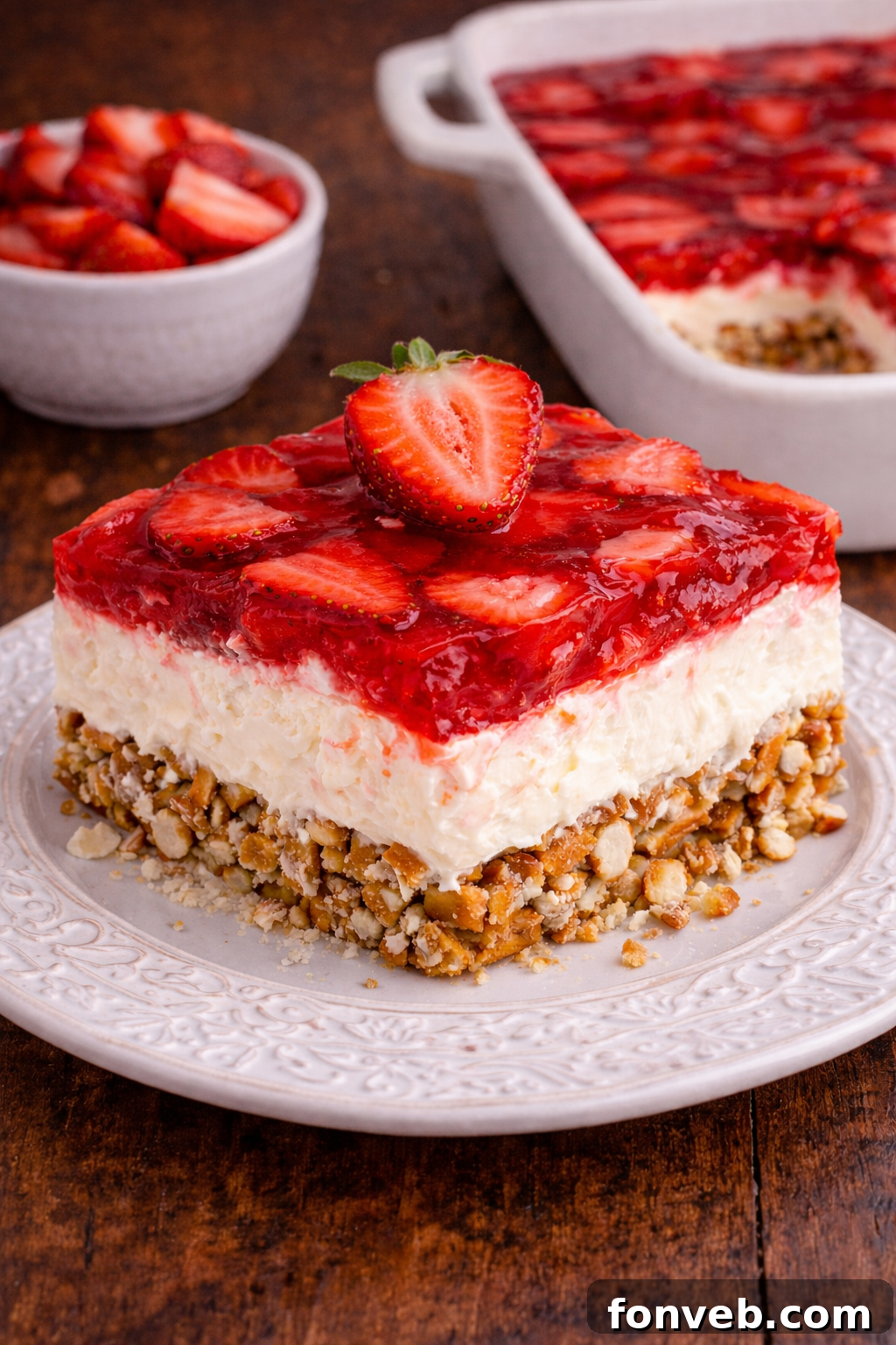 Strawberry Pretzel Salad on a pretty white plate 