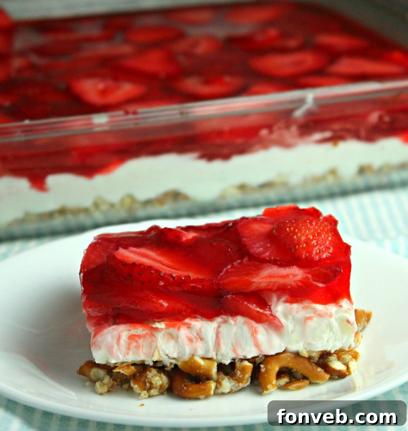 old image of my Strawberry Pretzel Salad on a pretty white plate 
