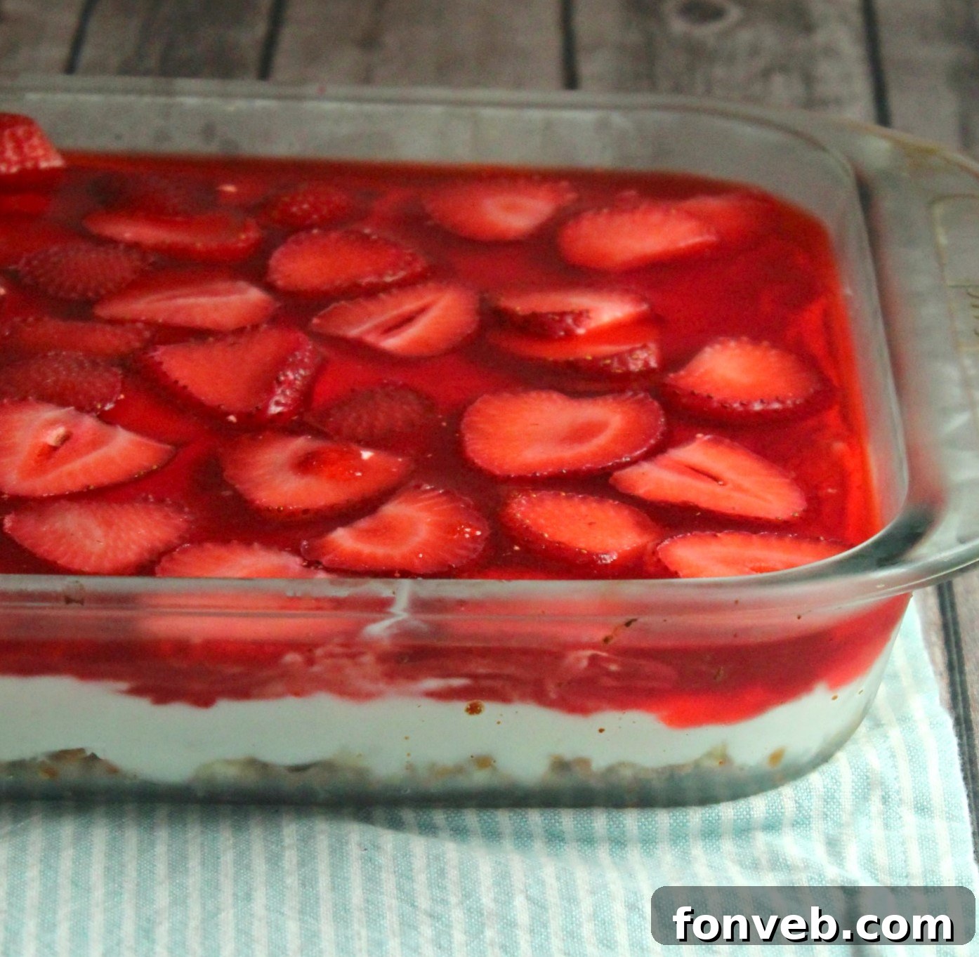 old image of my Strawberry Pretzel Salad in a clear baking pan 