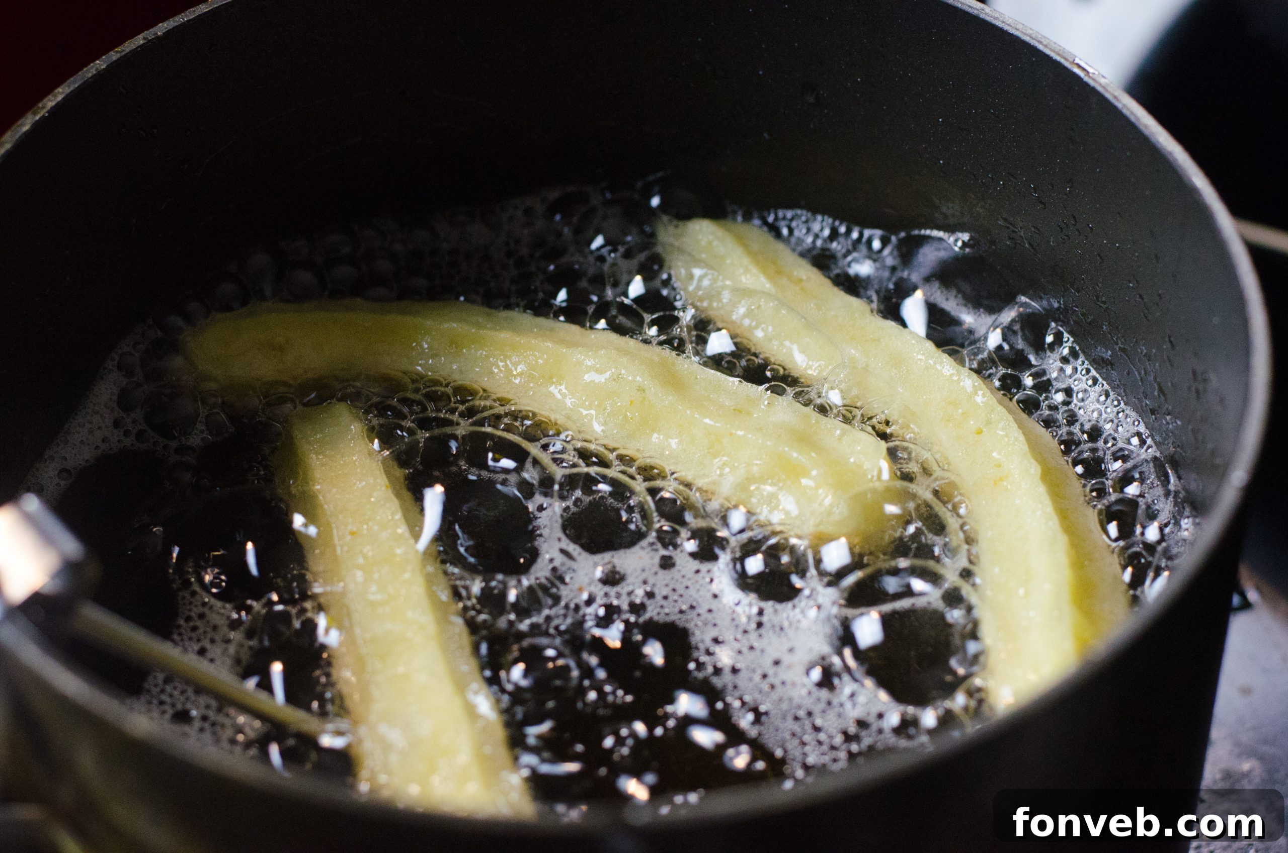 Close-up of crispy homemade churros with dipping sauce
