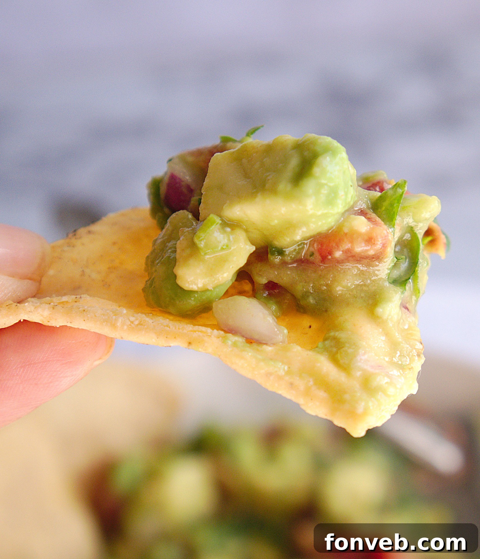 Another appealing shot of homemade chunky guacamole, emphasizing its freshness.