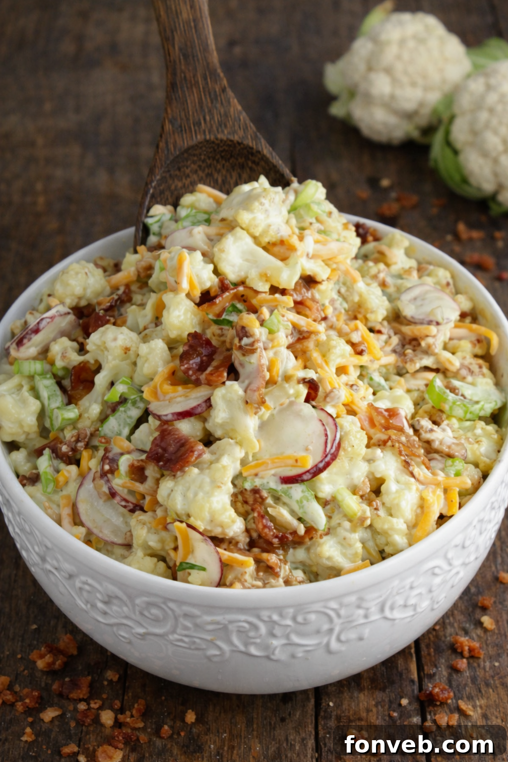 Loaded Cauliflower Salad in a pretty white bowl