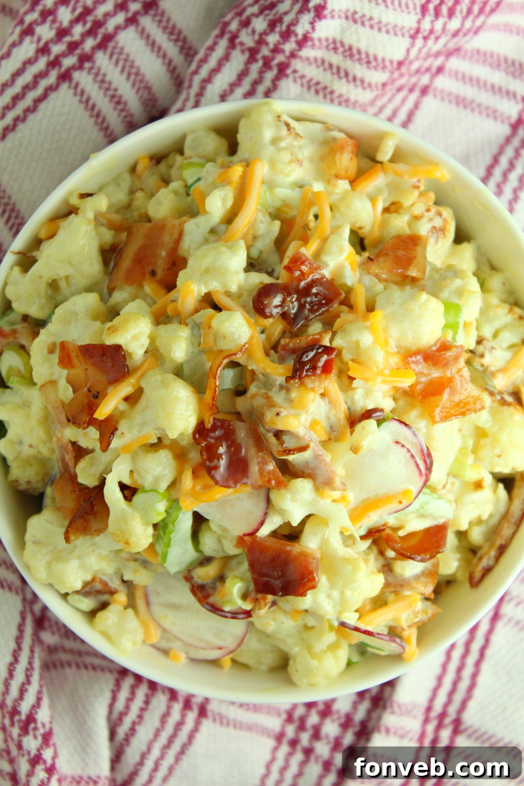 Ingredients for Loaded Cauliflower Salad laid out on a kitchen counter